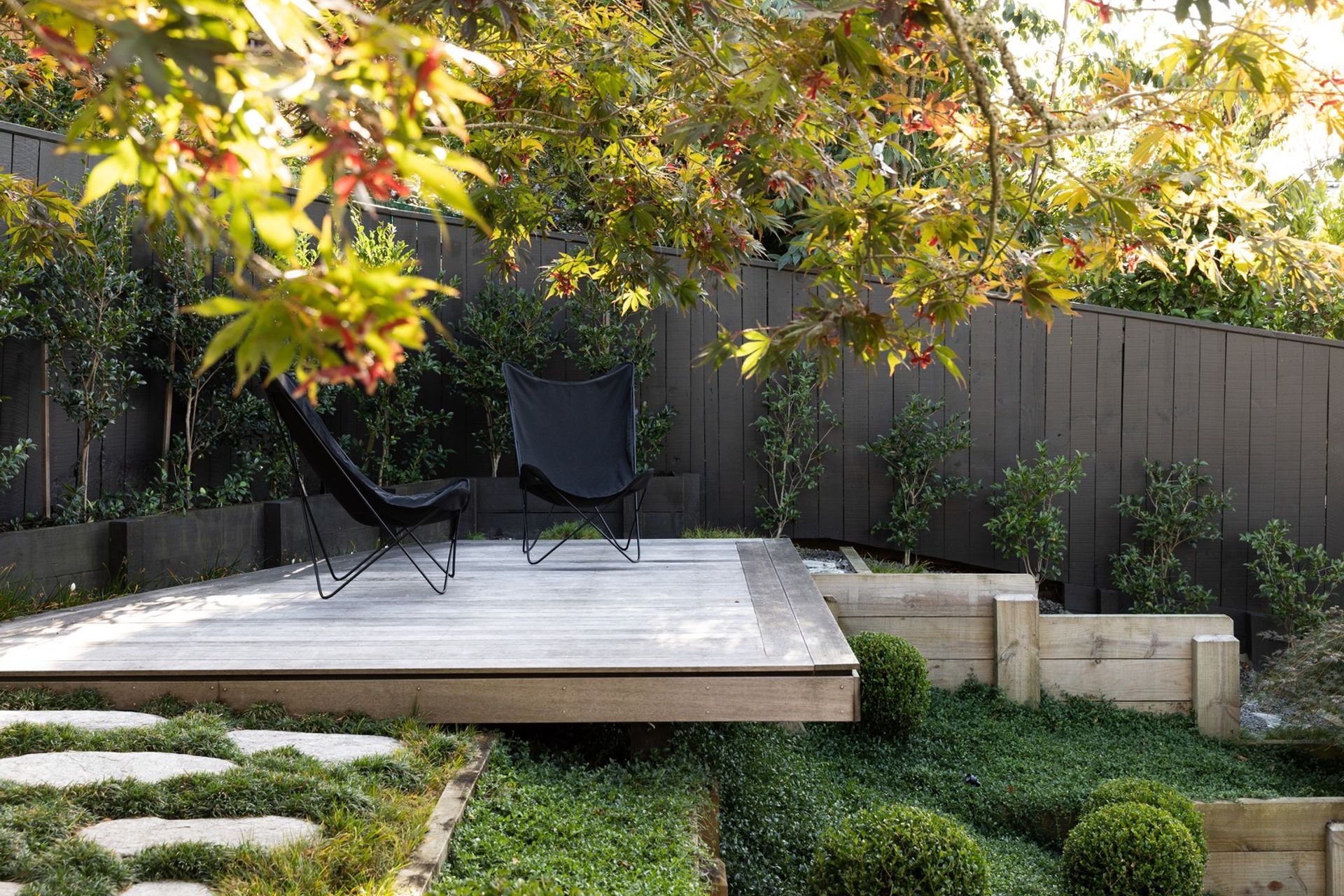 Hardscaping can be used to create sanctuaries of solitude, like this delightful space here in Crocus Place.
