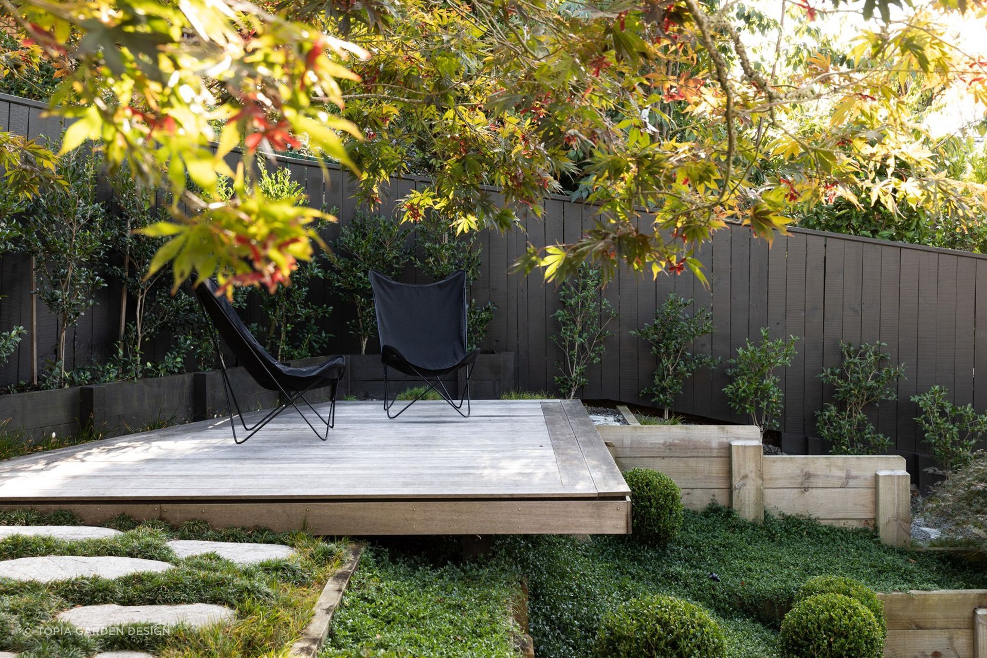 Hardscaping can be used to create sanctuaries of solitude, like this delightful space here in Crocus Place.