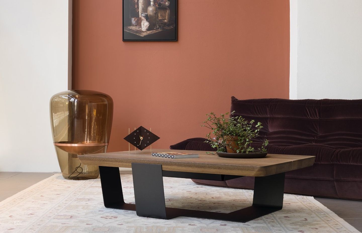 A table clock is a unique way to infuse a bit of character and style into a space, seen here with the ECC Crossings Coffee Table by QLiv