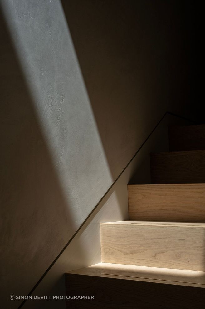 Even transitional spaces are carefully resolved, with light, material and movement working together to shape how the home is experienced from one level to the next.
