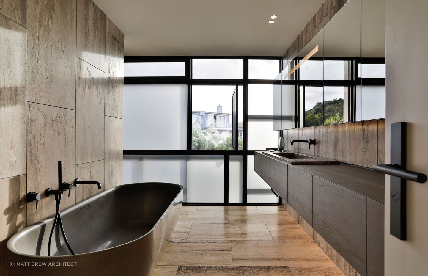 Earthy tones create instant warmth in this sophisticated bathroom in Eastern Beach.