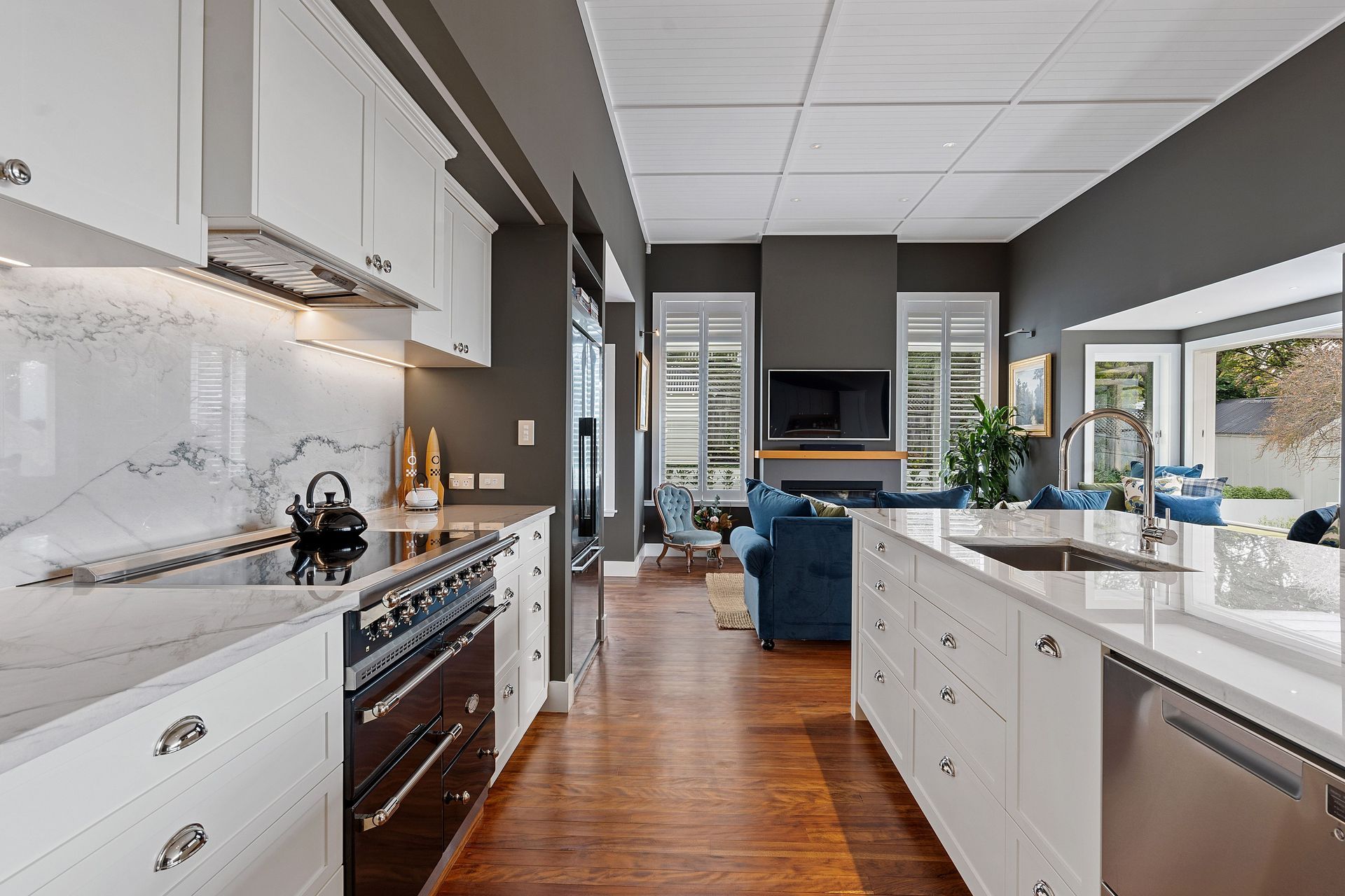 Ainsworth + Collinson's expertise in kitchen cabinetry is evident in every aspect of this project, from the seamless integration of bespoke cabinets to the impeccable finishing touches that elevate the space to new heights of sophistication.