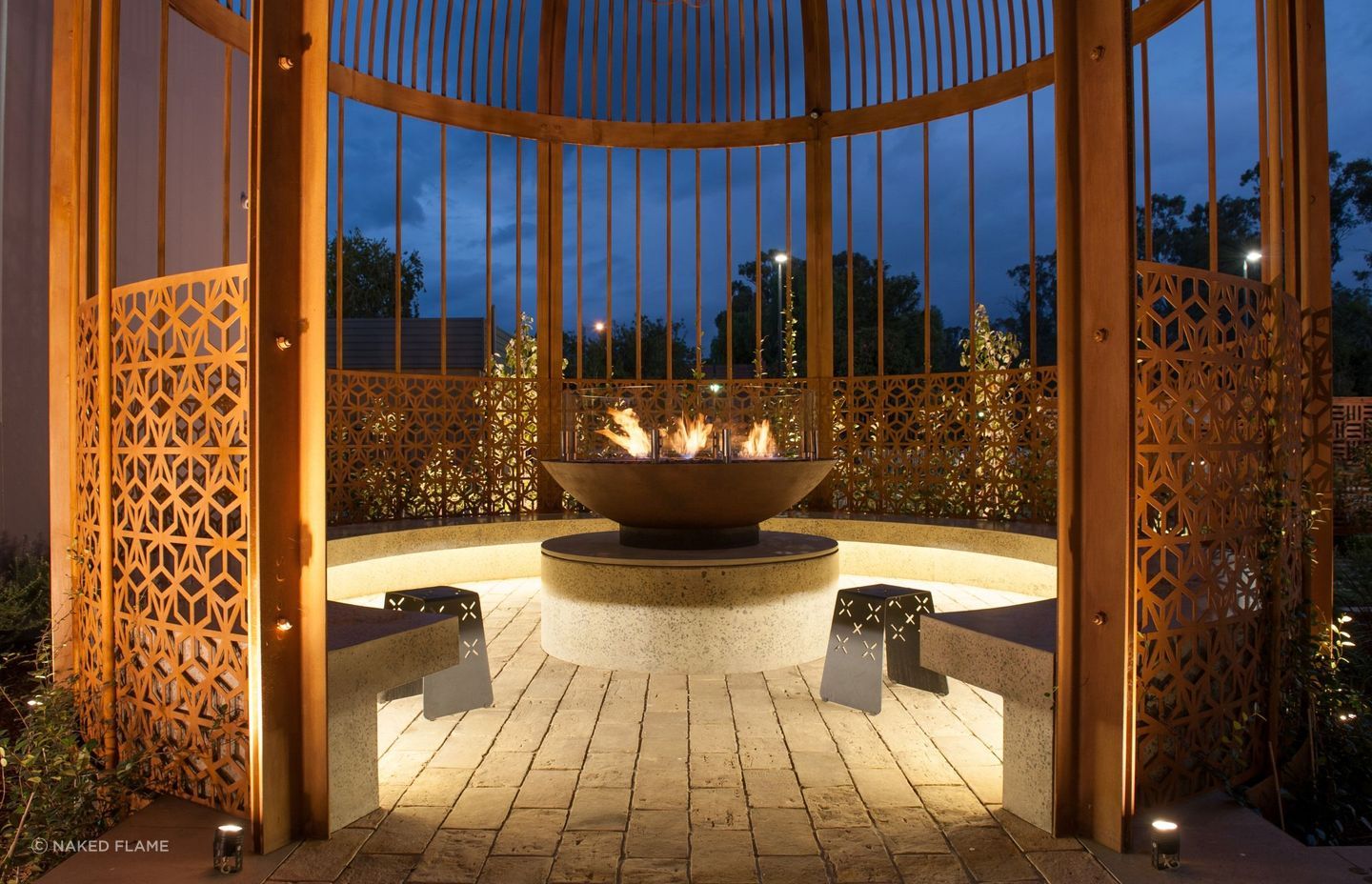 You can create a sanctuary within a sanctuary using a fire pit like the EcoSmart XL500 Ethanol Biofuel Fireplace and a garden shelter.
