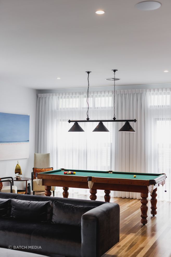This games room by Black Lines Concept brings together the clients' love of music and game playing.