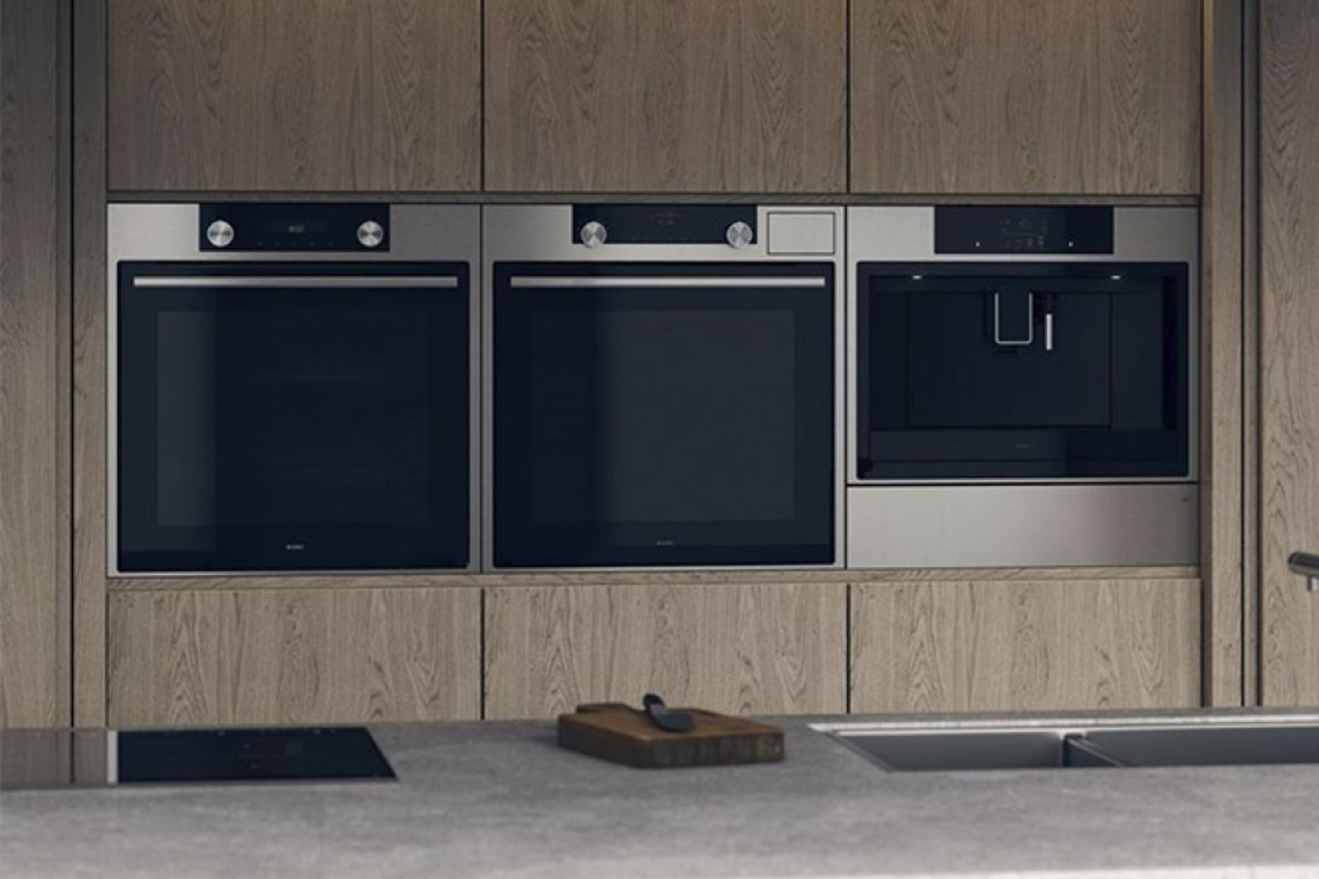 Sleek solutions, like the Elements Warming Drawer from ASKO (far right), seamlessly blend into a kitchen.