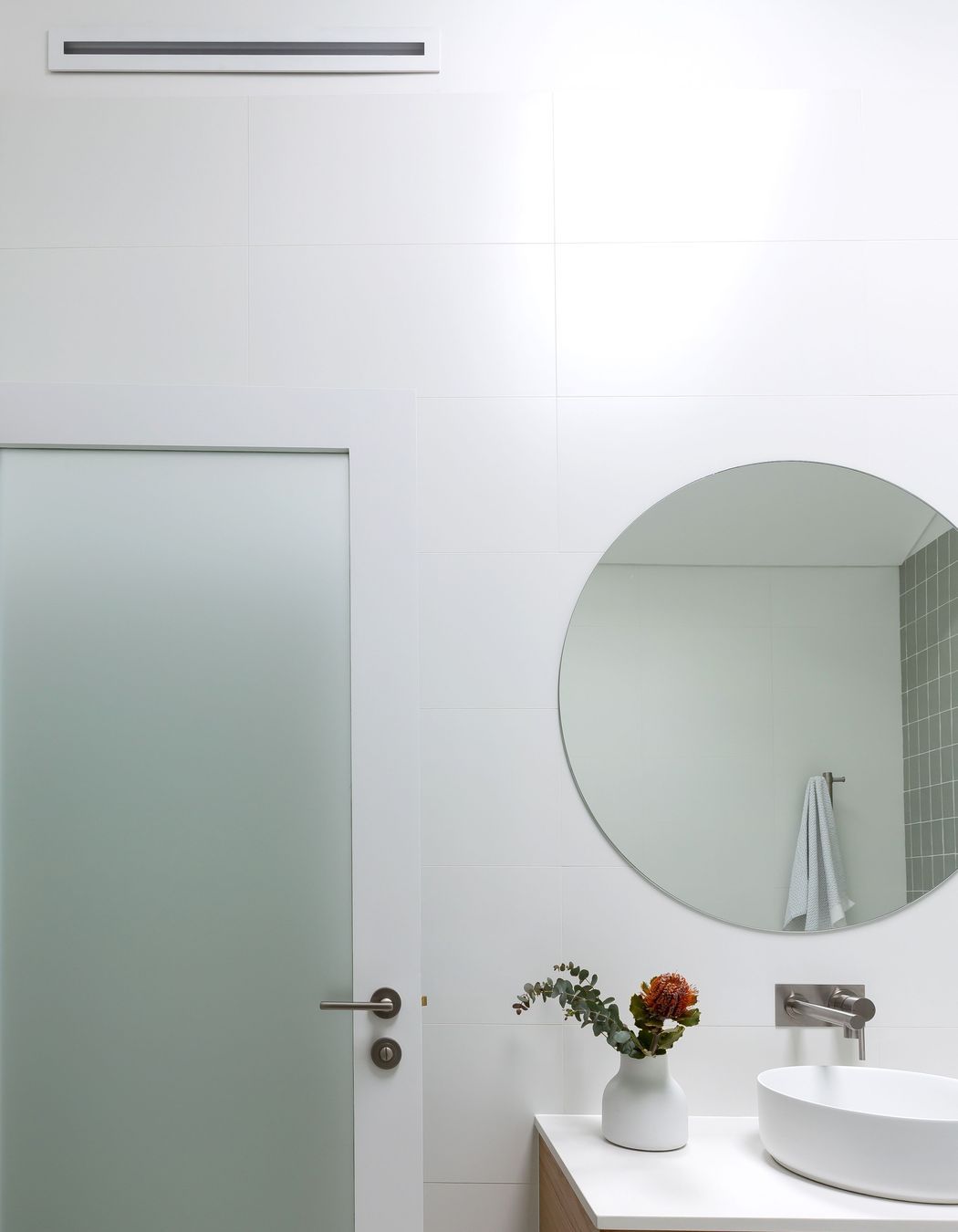 An inline ventilation system with Expella’s Linear Slot Grille positioned on the wall channels damp air into the extraction system.