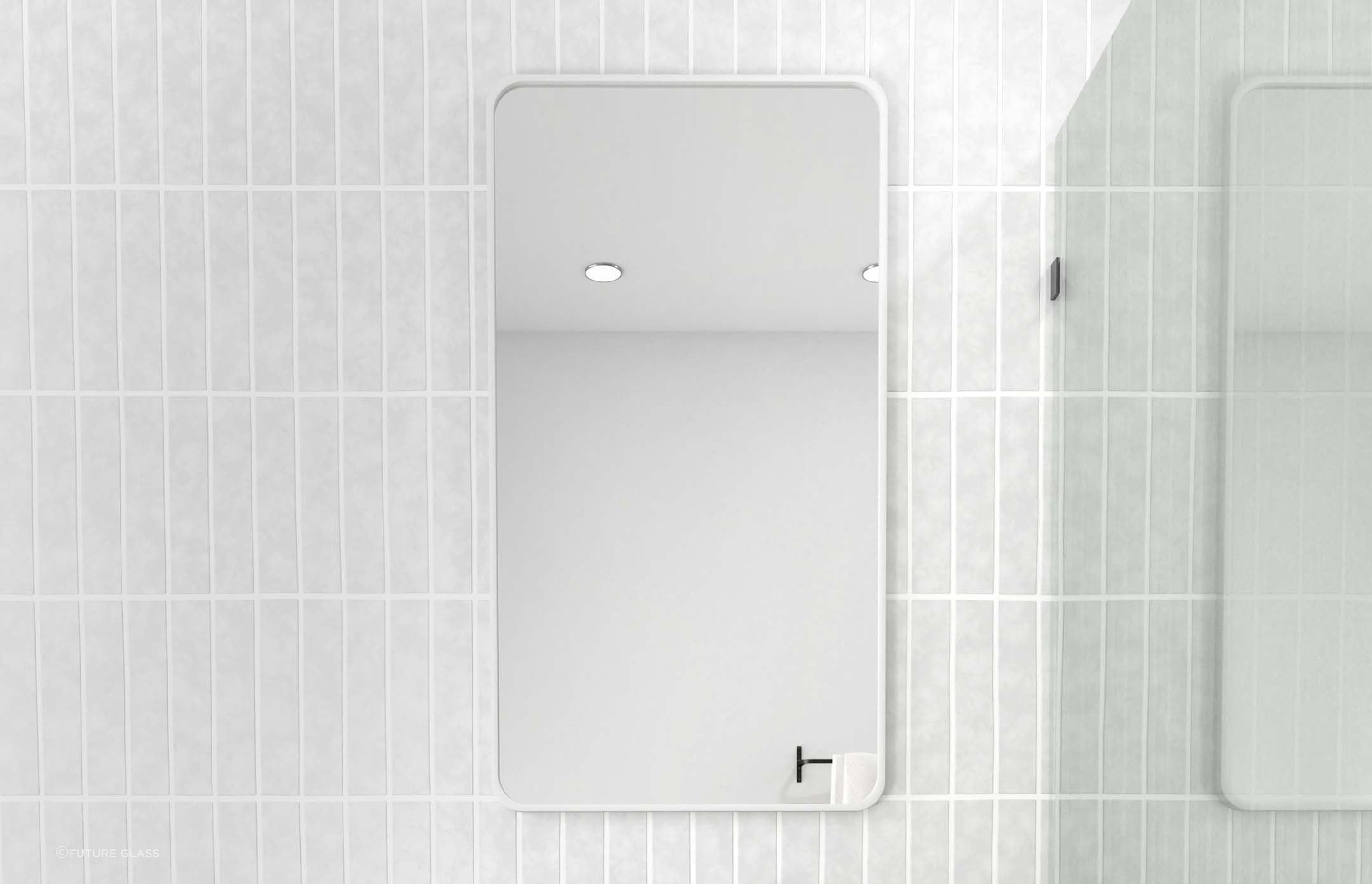 A rectangular bathroom mirror enhances a bathroom with its simplistic yet timeless charm. Featured product: Radius Rectangle Mirror.