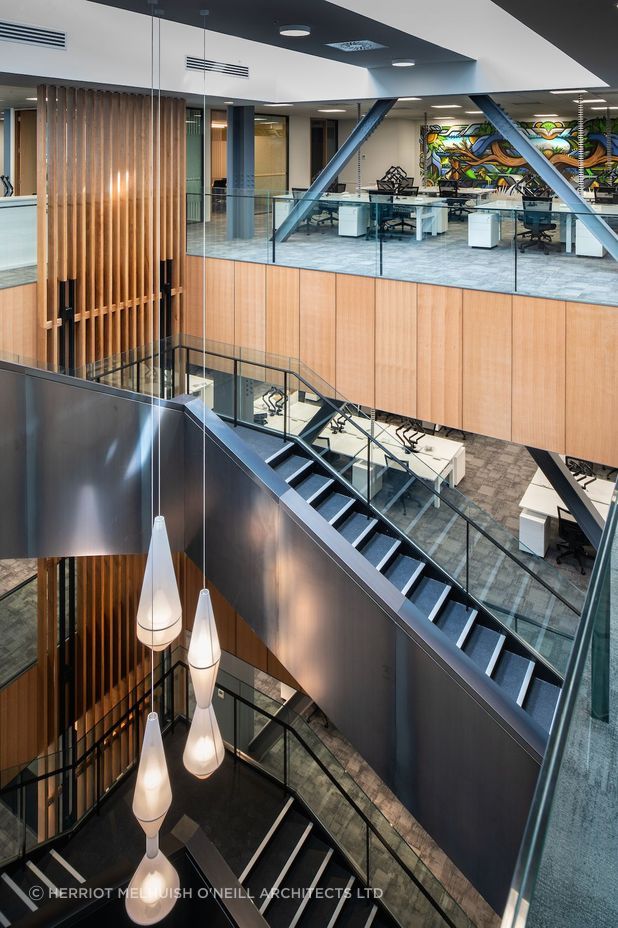 A dramatic internal stair has been inserted through the centre of the space and natural light is maximised with skylights.