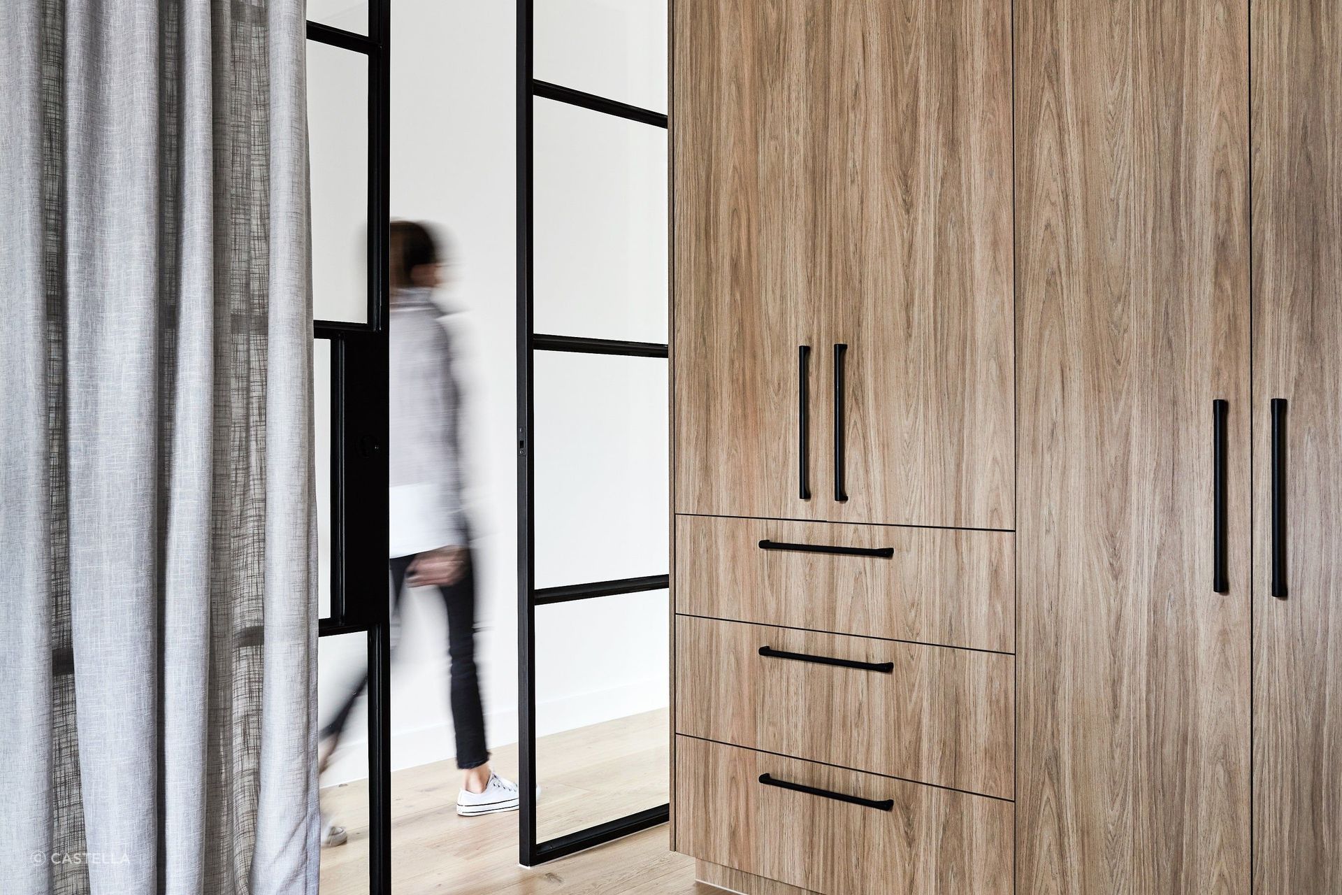 Honey-toned Timber Storage Featuring our Terrace Pull Handles in Matt Black