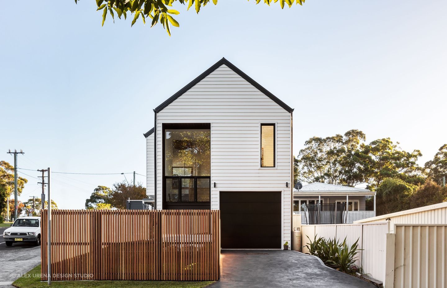 Picket fence surrounding modern home