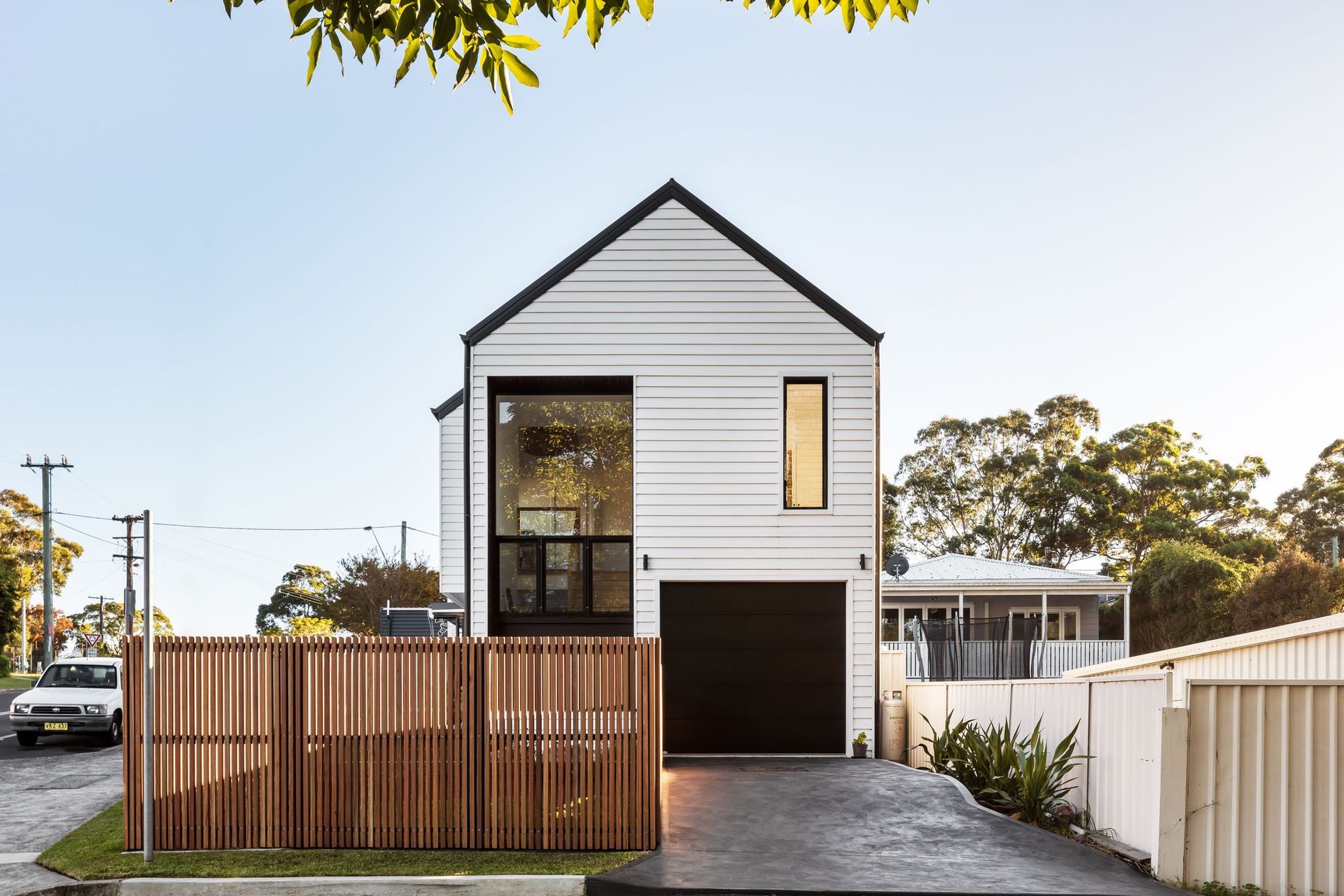 Picket fence surrounding modern home