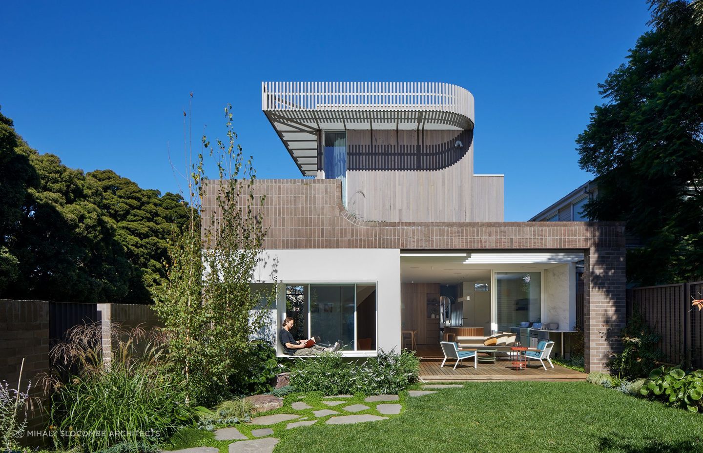 A sculpted extension of an unassuming weatherboard cottage by Mihaly Slocombe Architects.
