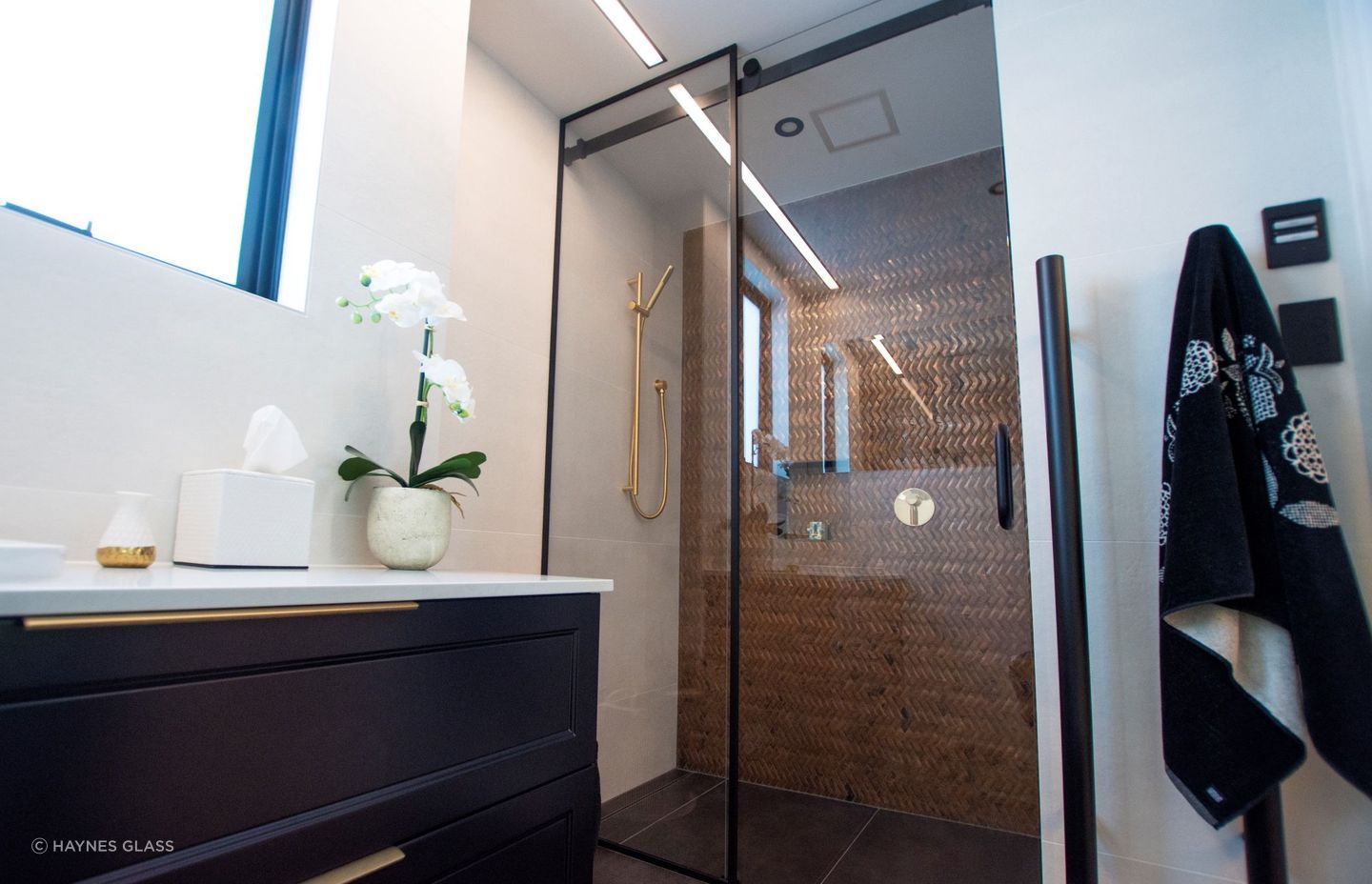 Sliding doors are great space savers and can be used as the entry door to your bathroom or for your shower as seen here.