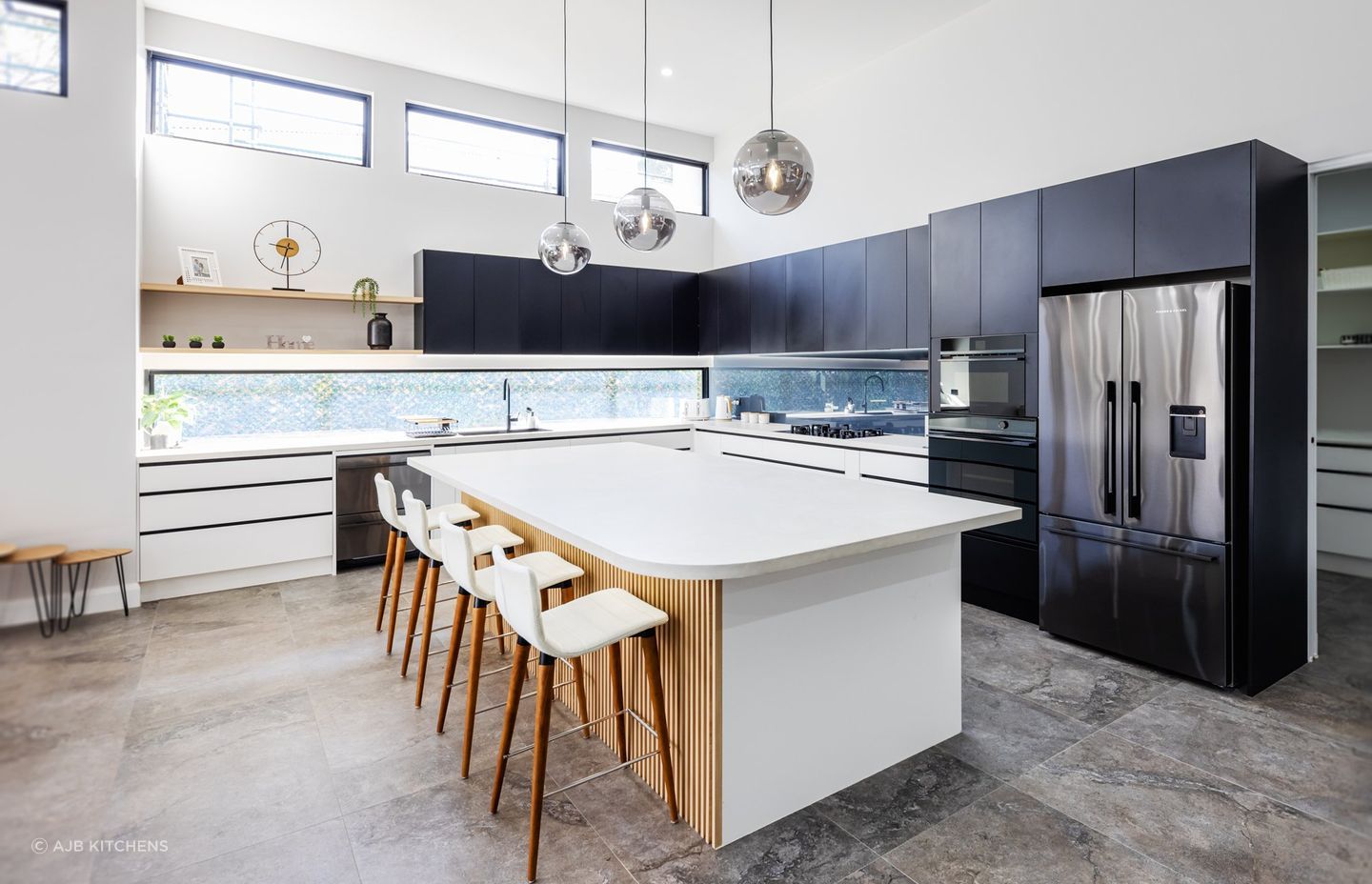 Globe pendant lights, while looking a little retro, still work in modern kitchens.