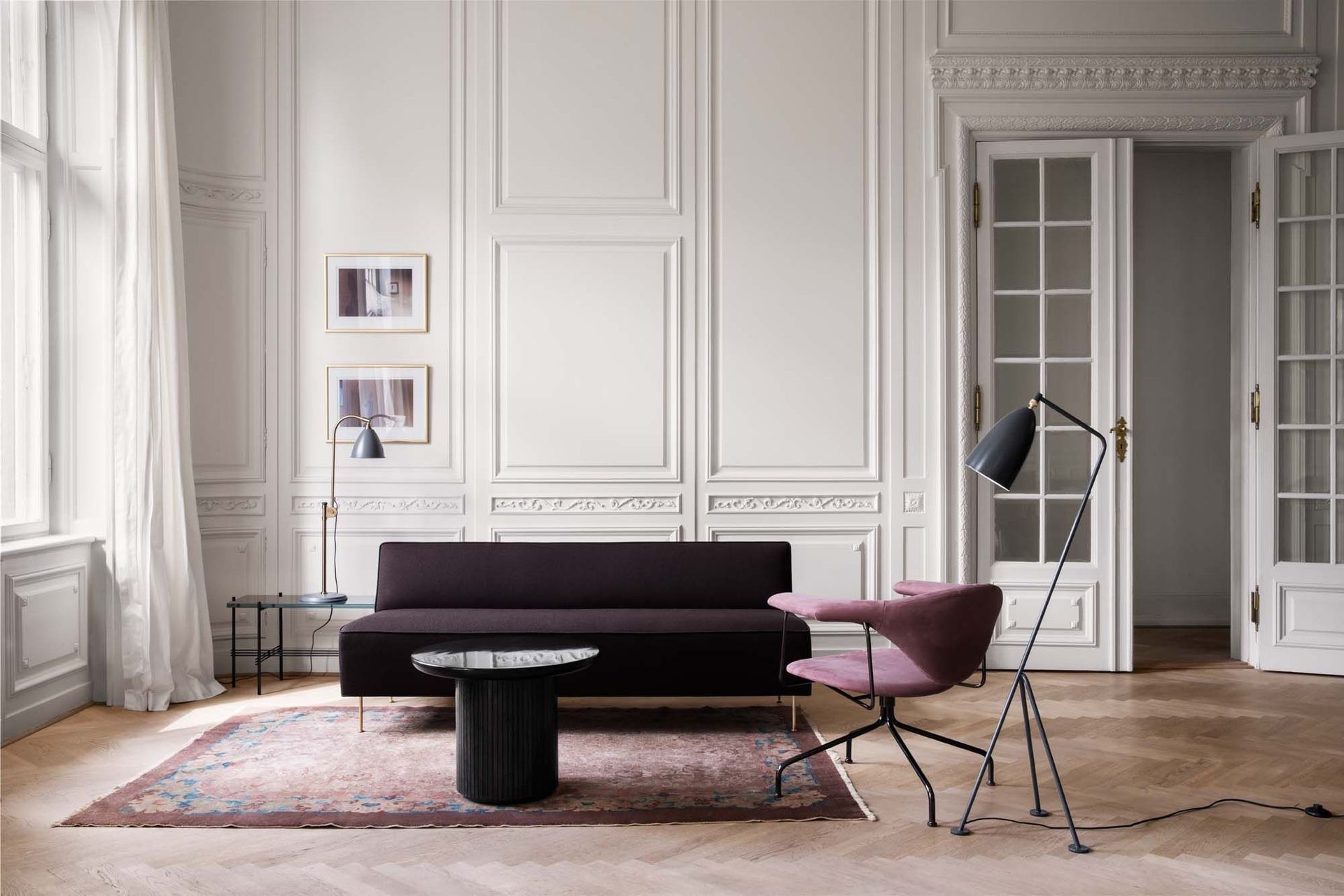 The Grasshopper Floor Lamp by GUBI forms an important part of the lighting plan in this stylish space.