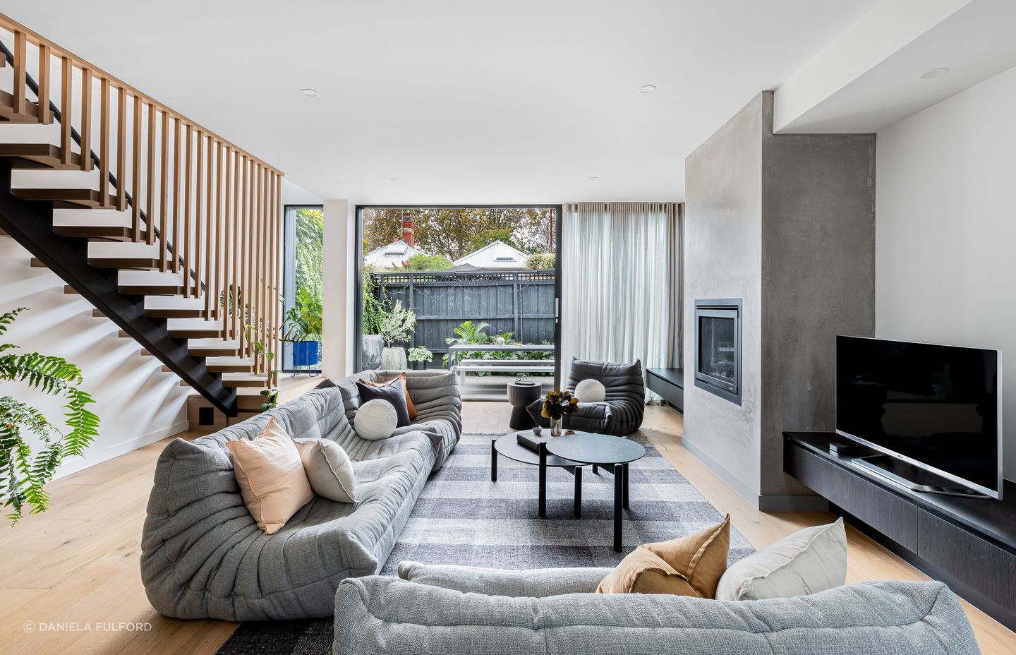 Cream, grey and light brown cushions give this sofa soft earthy tones. Featured project: Vail