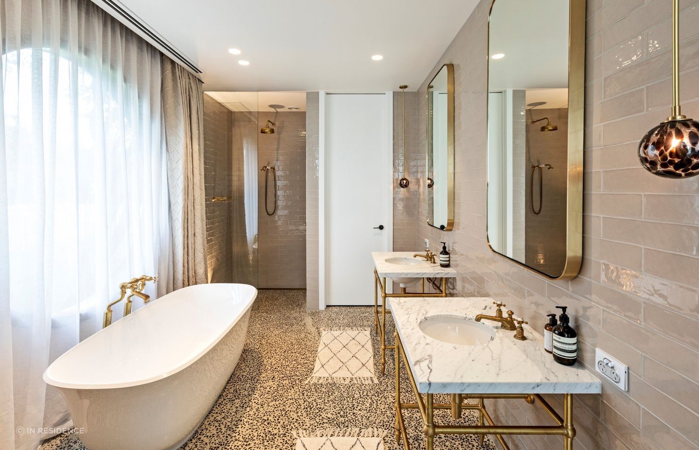 The Hawthorn Hill Basin Stand Vanity from In Residence, featuring an undermount basin, allowing its beautiful finish to shine.