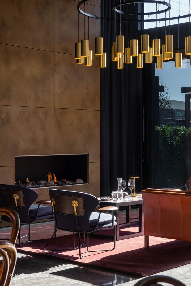 At 1.8m in diameter, the chandelier is a statement piece above the fireplace.