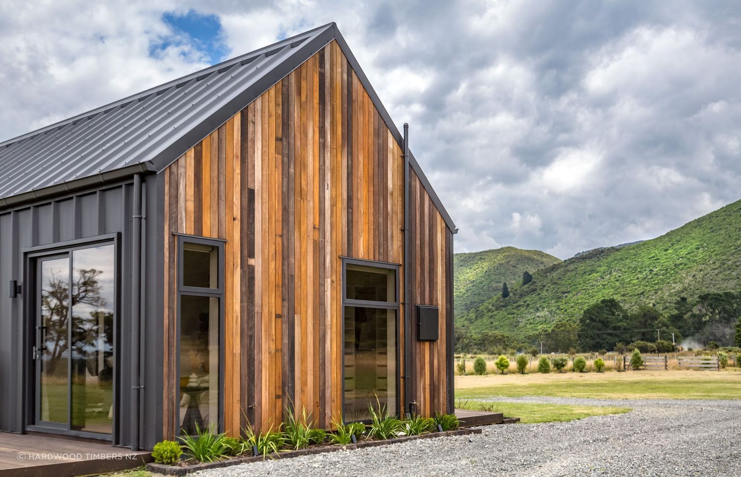 A stunning example of Mixed Species Hardwood Cladding in Vertical Shiplap from Hardwood Timbers NZ.