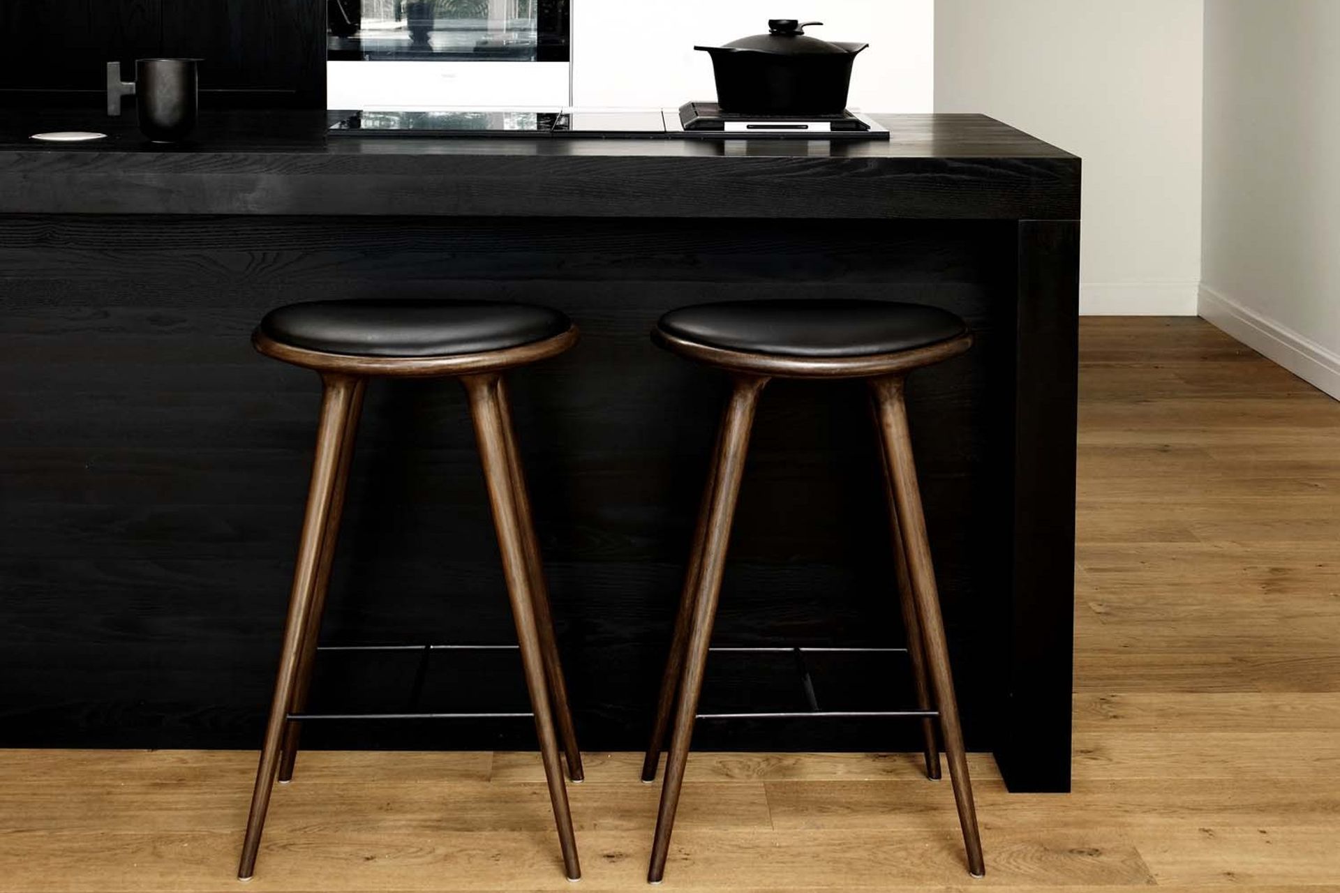 Choosing bar stools that complement the interior styling of your space is crucial, stylishly executed here with the High Stool by Mater from Cult Design.