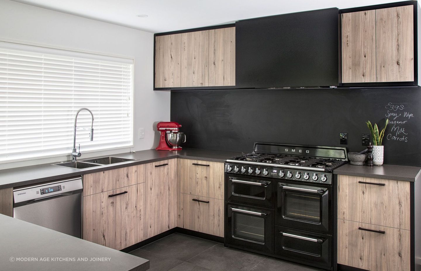 Kitchen appliances can also be used for design purposes, like a vibrant injection of colour seen in this Parklands Kitchen by Modern Age Kitchens and Joinery.