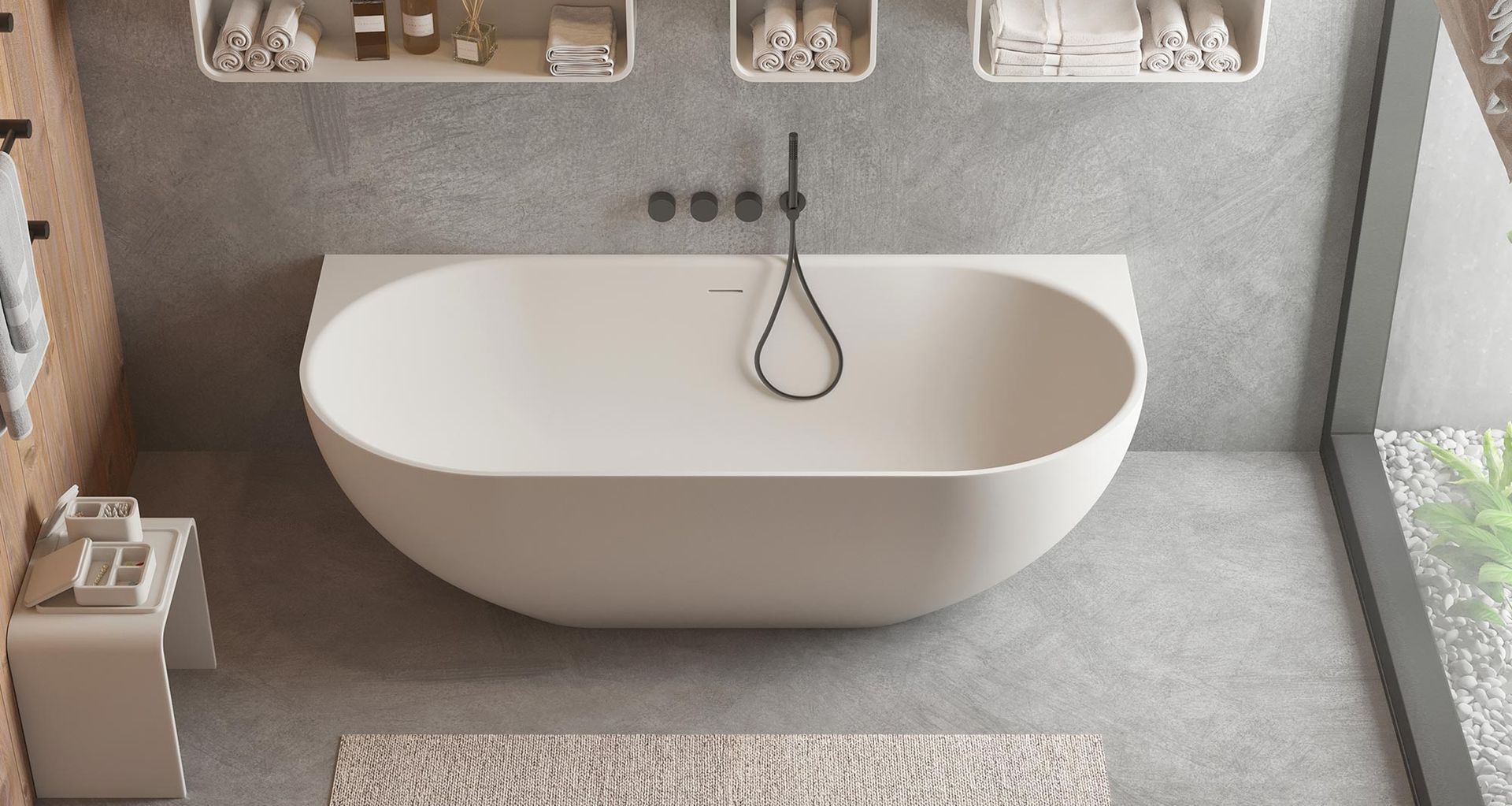The Justina Back-to-Wall Stone Bath.
