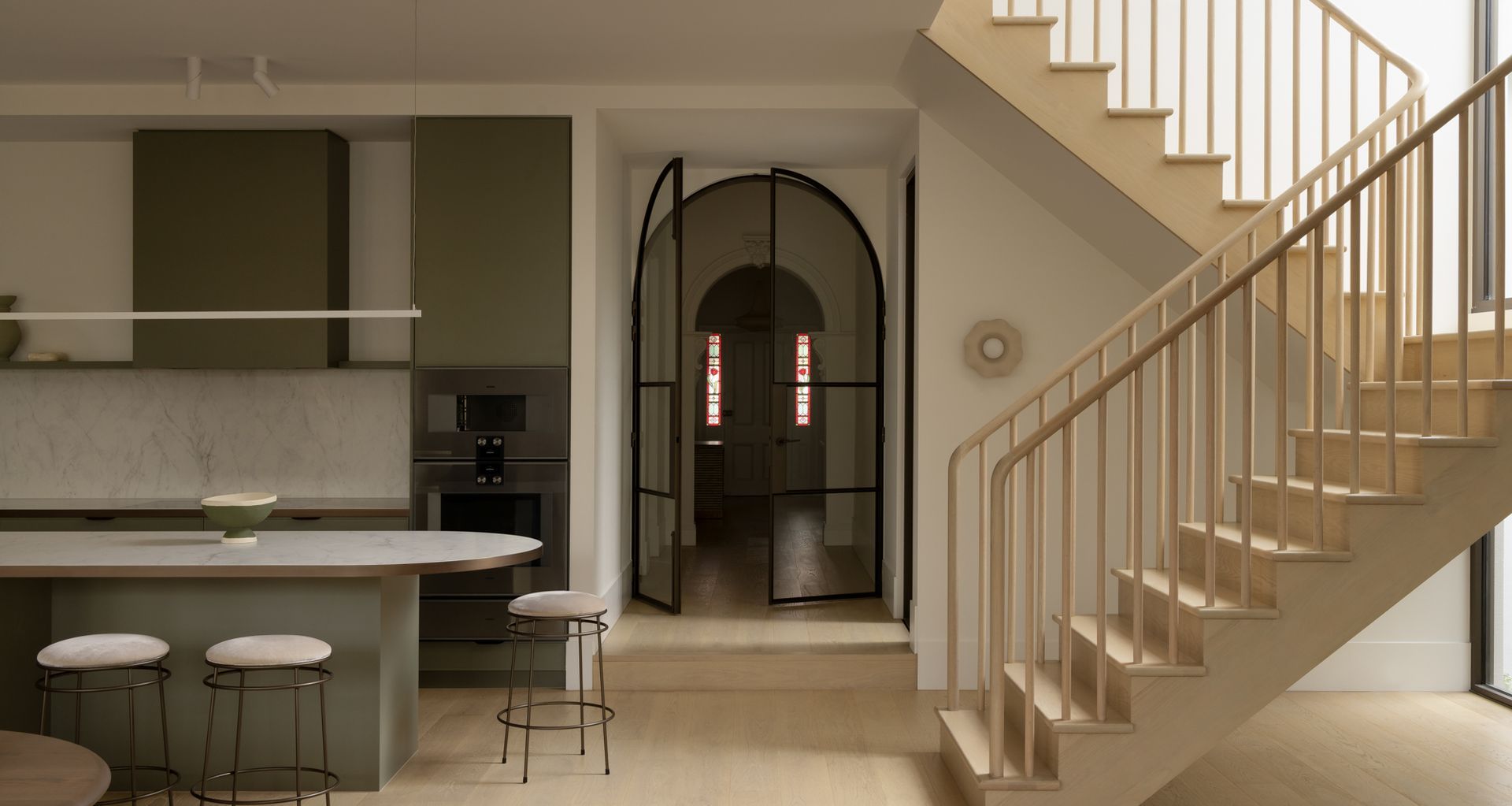 This renovation transformed a brick Victorian cottage into a refined two-storey contemporary residence.