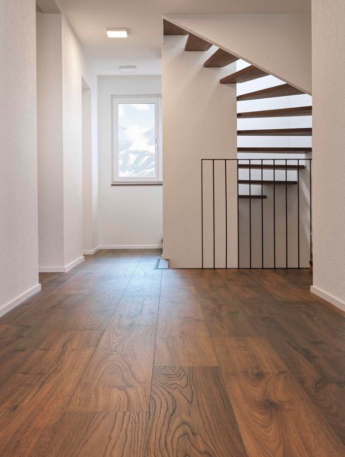 “Different flooring types (hardwood, tile, laminate, carpet, etc.) may require specific cleaning products or techniques. Using the wrong product or method can damage the floor’s functionality, causing issues like warping, fading, or cracking.” Image: KronoSwiss Laminate in Sunset.