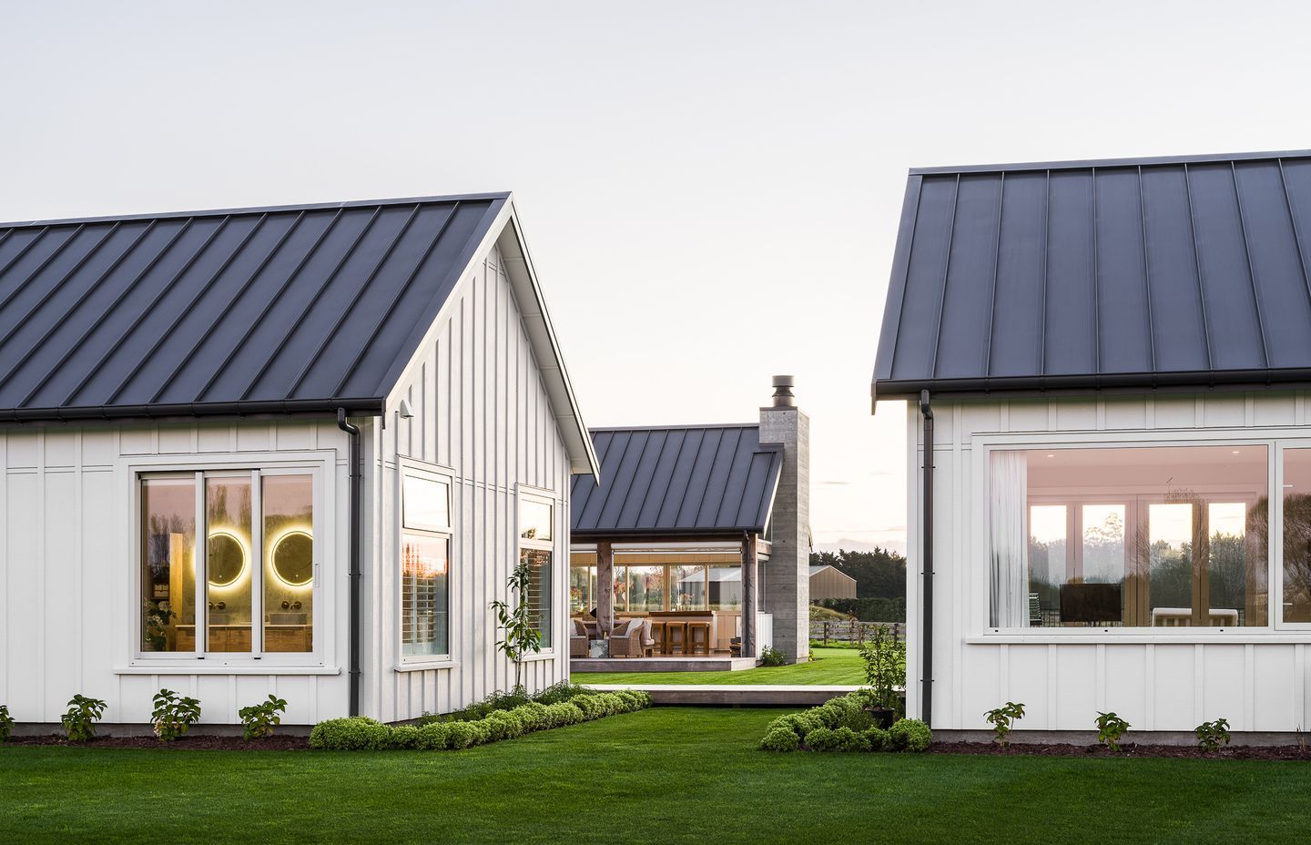 The gable forms in this Christchurch home are elevated by the tray roof, giving the buildings a sophisticated appeal.