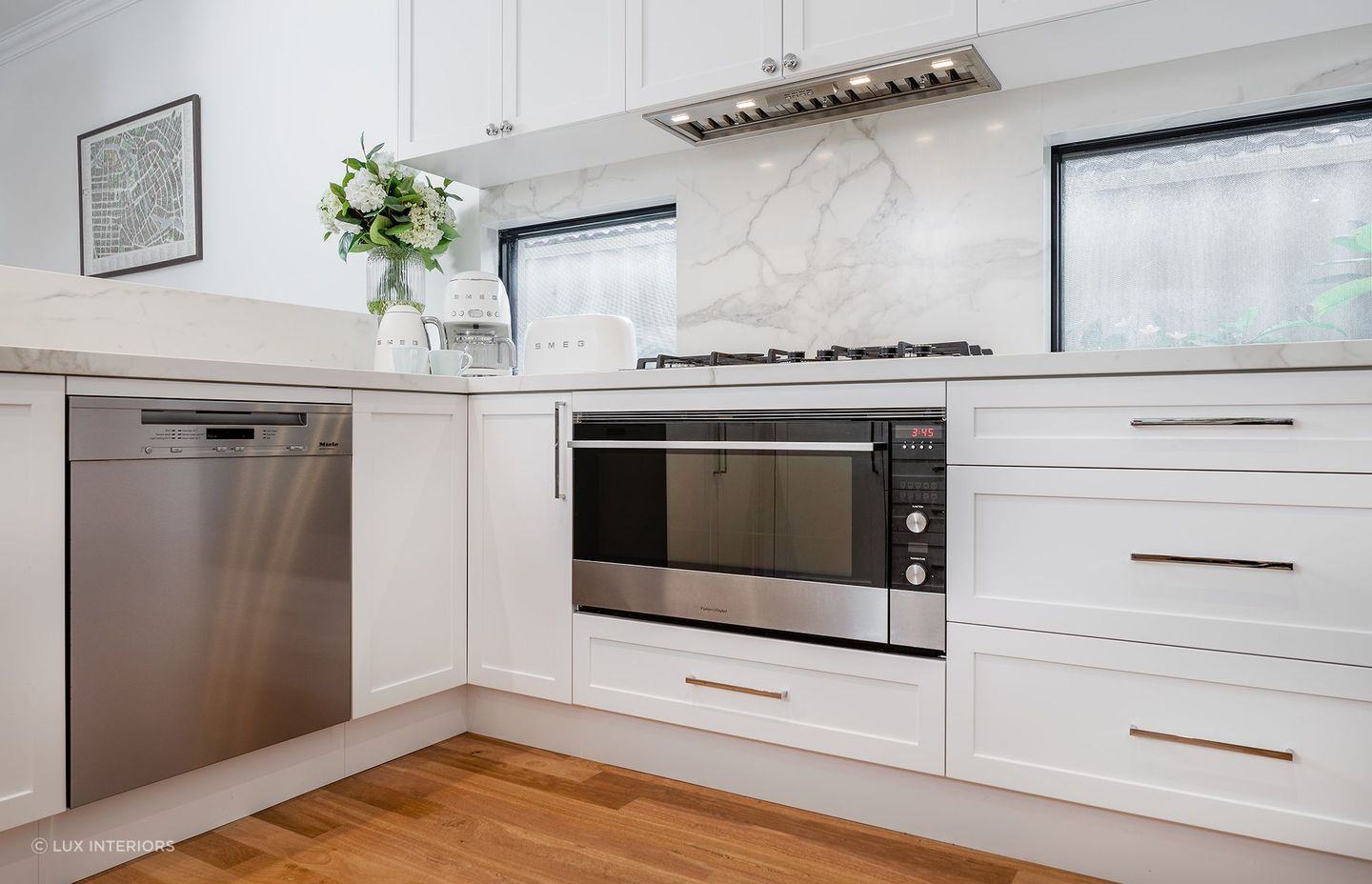 A collection of Smeg small appliances makes for a cohesive look in this Hampton's style home by Lux Interiors. | Photography: Silvertone Photography