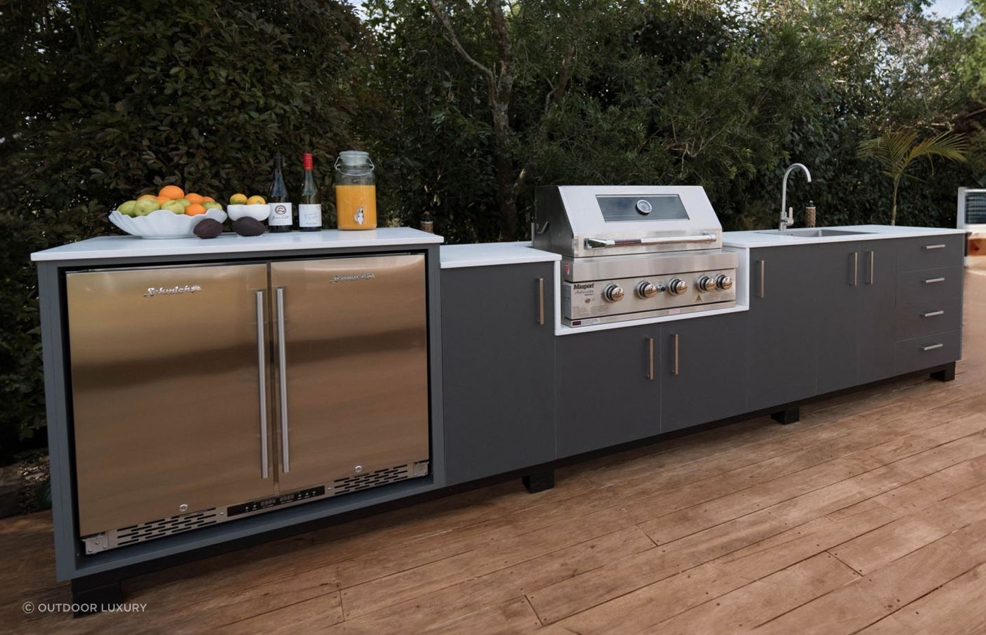 A large outdoor kitchen like this by Outdoor Luxury can help you maximise your outdoor space.