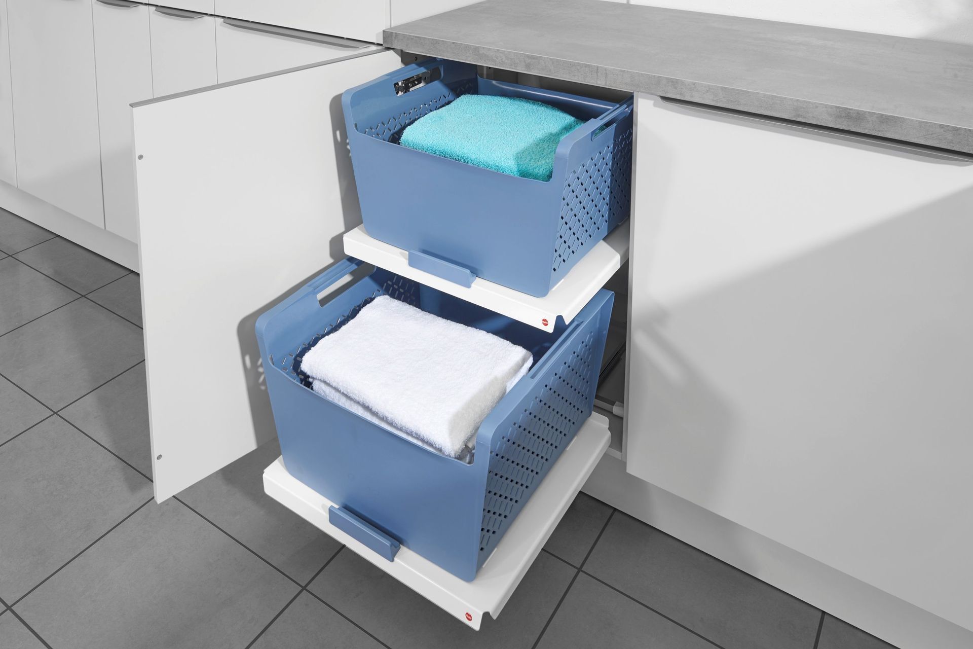 The convenience of the Laundry Pull-Out Shelf + Basket by Häfele New Zealand cannot be understated.