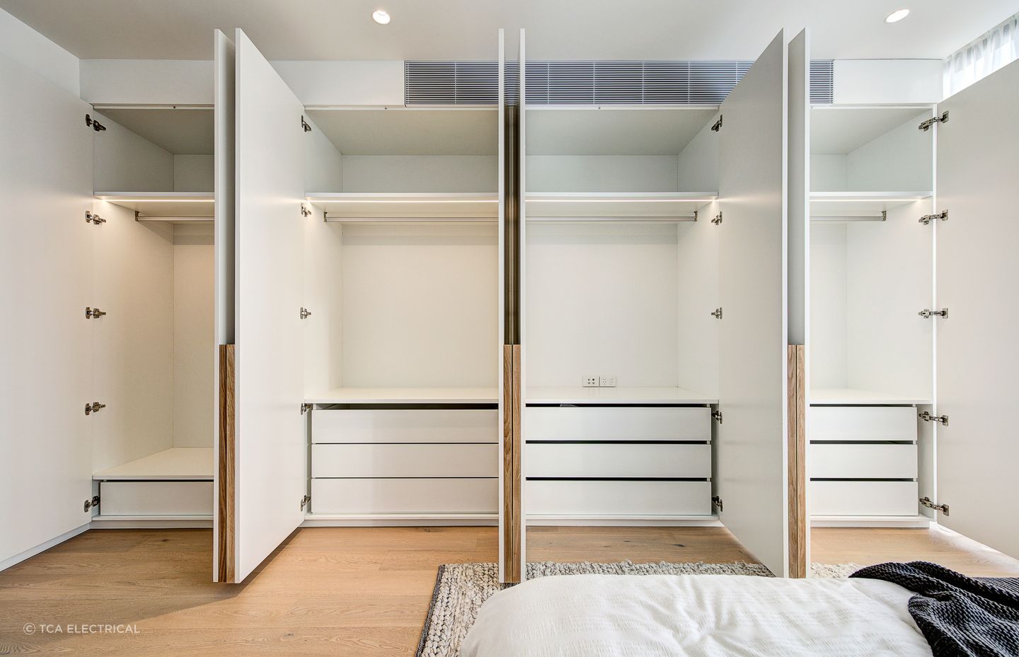 Downlights can be used to brighten specific areas in a room, such as the inside of a wardrobe Featured project: Liverpool St, Darlinghurst.