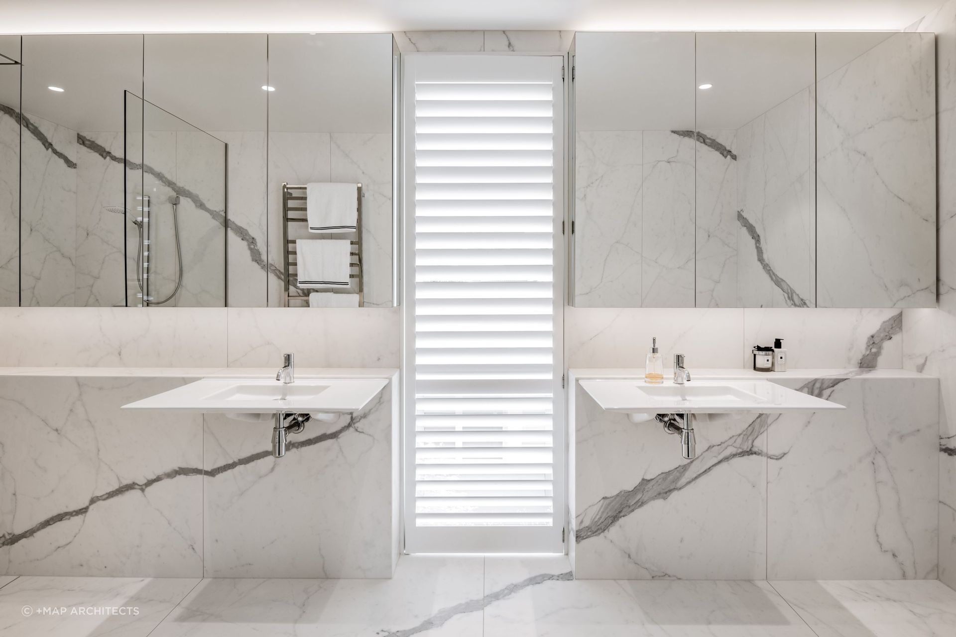 Floating sinks are a rare find but an elegant touch, seen here in the delightful Maple Courtyard House in Christchurch — Photography: Stephen Goodenough