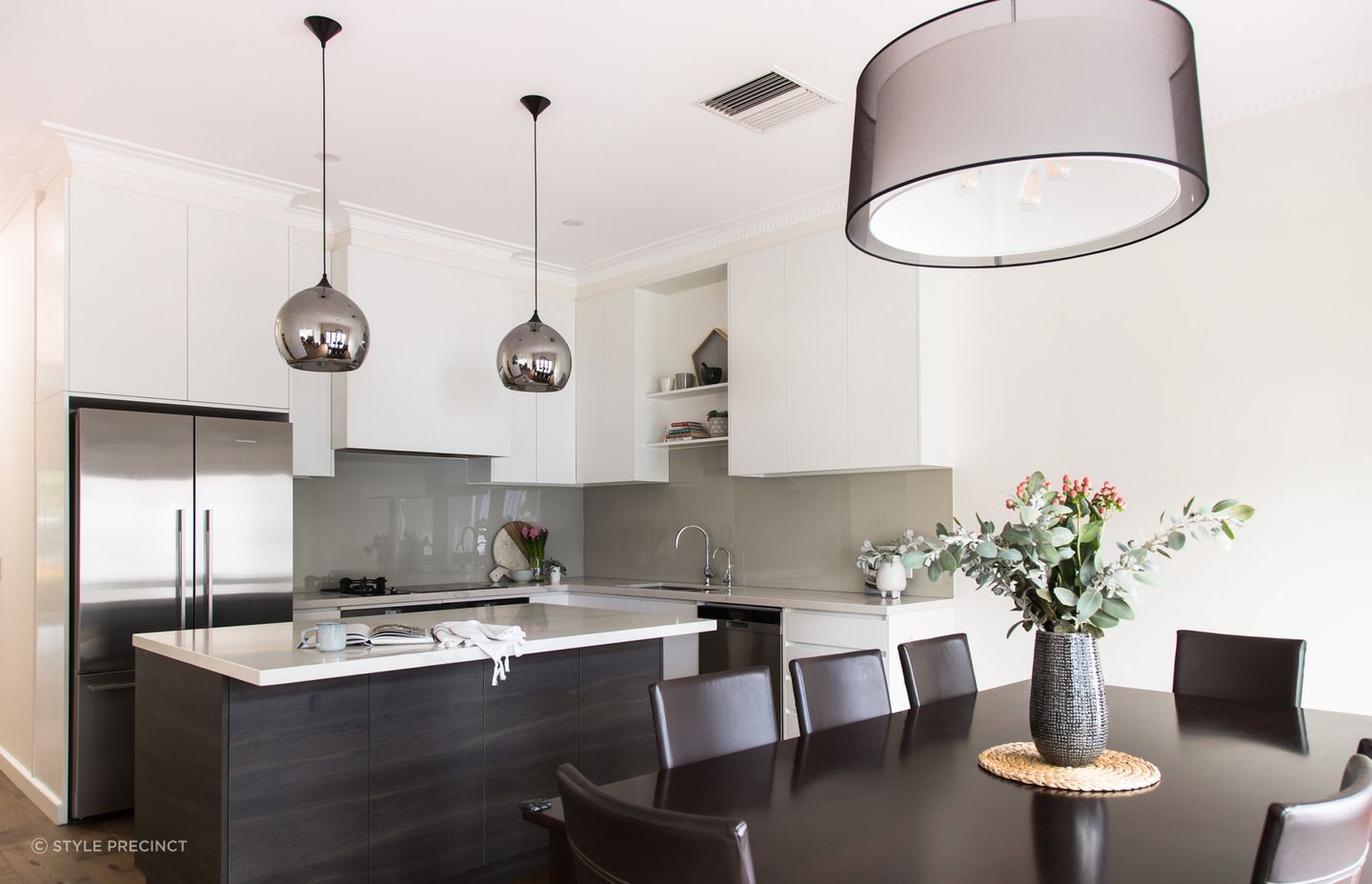 Reflective surfaces such as a fridge, or particular lighting fixtures help reflect light around the room. Photography: Suzi Appel.