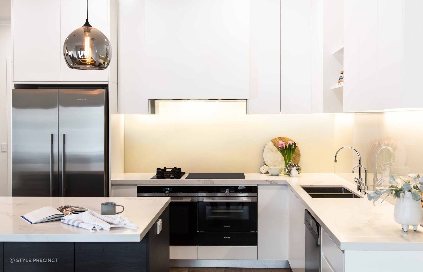 Undercabinet lighting, like the solution used in this modern kitchen renovation in McKinnon, brings stylish clarity and sheen. | Photography: Suzi Appel