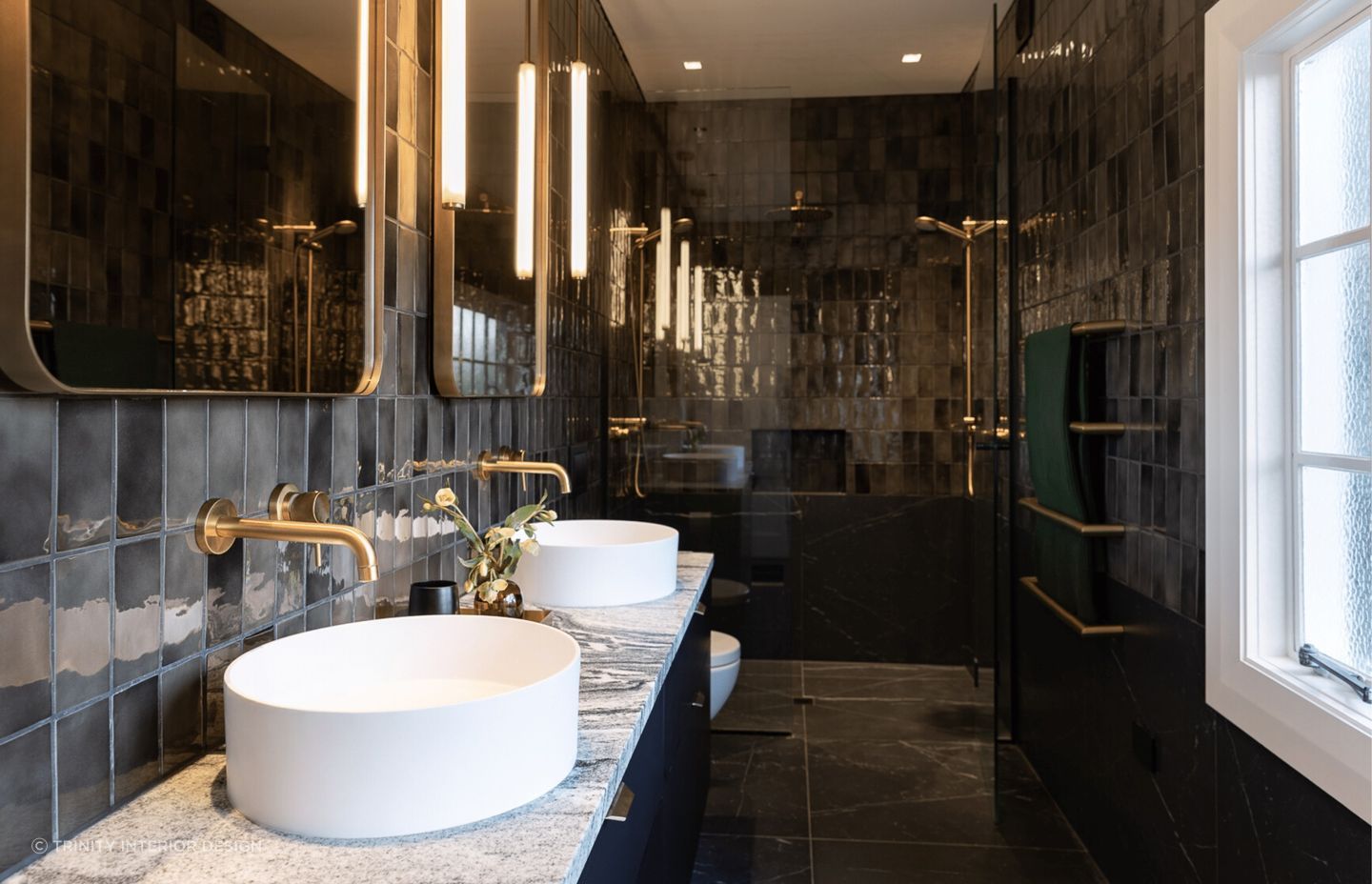 The glossy tiles of this bathroom in Mount Eden adds an undeniable shine.