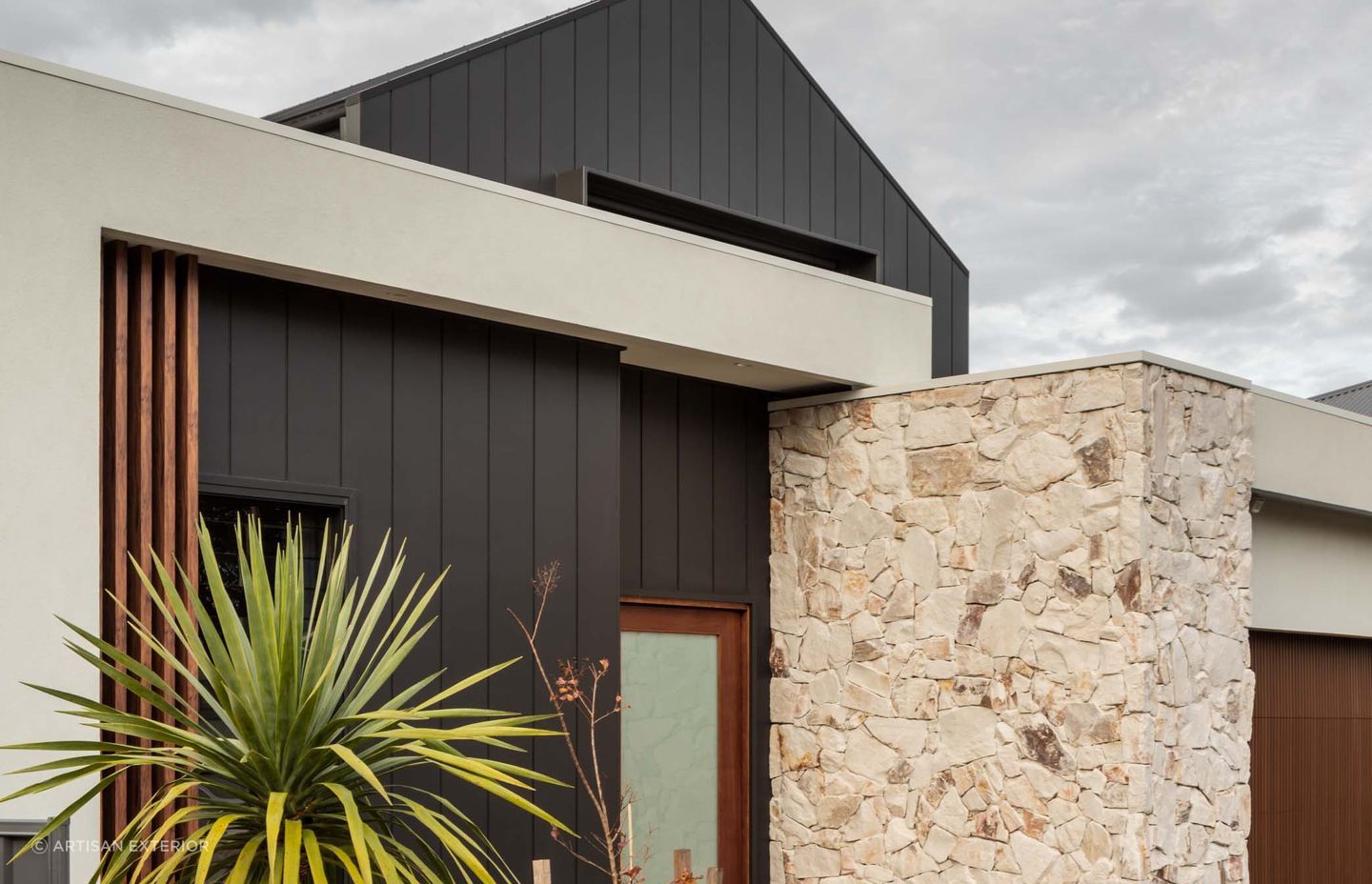 Natural stone cladding can is often used on a homes exterior in conjunction with other external cladding materials. Featured product: Callala Organic Stone Wall Cladding.