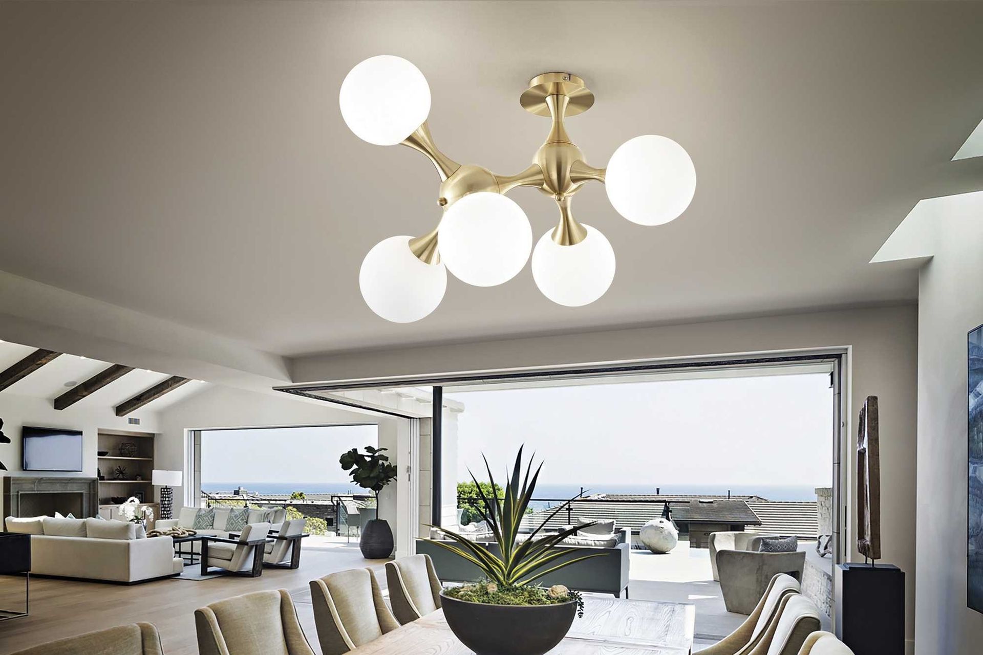 The Nodi Ceiling Light from Lighthouse Lighting offers pendant light qualities with its semi flush mount design.