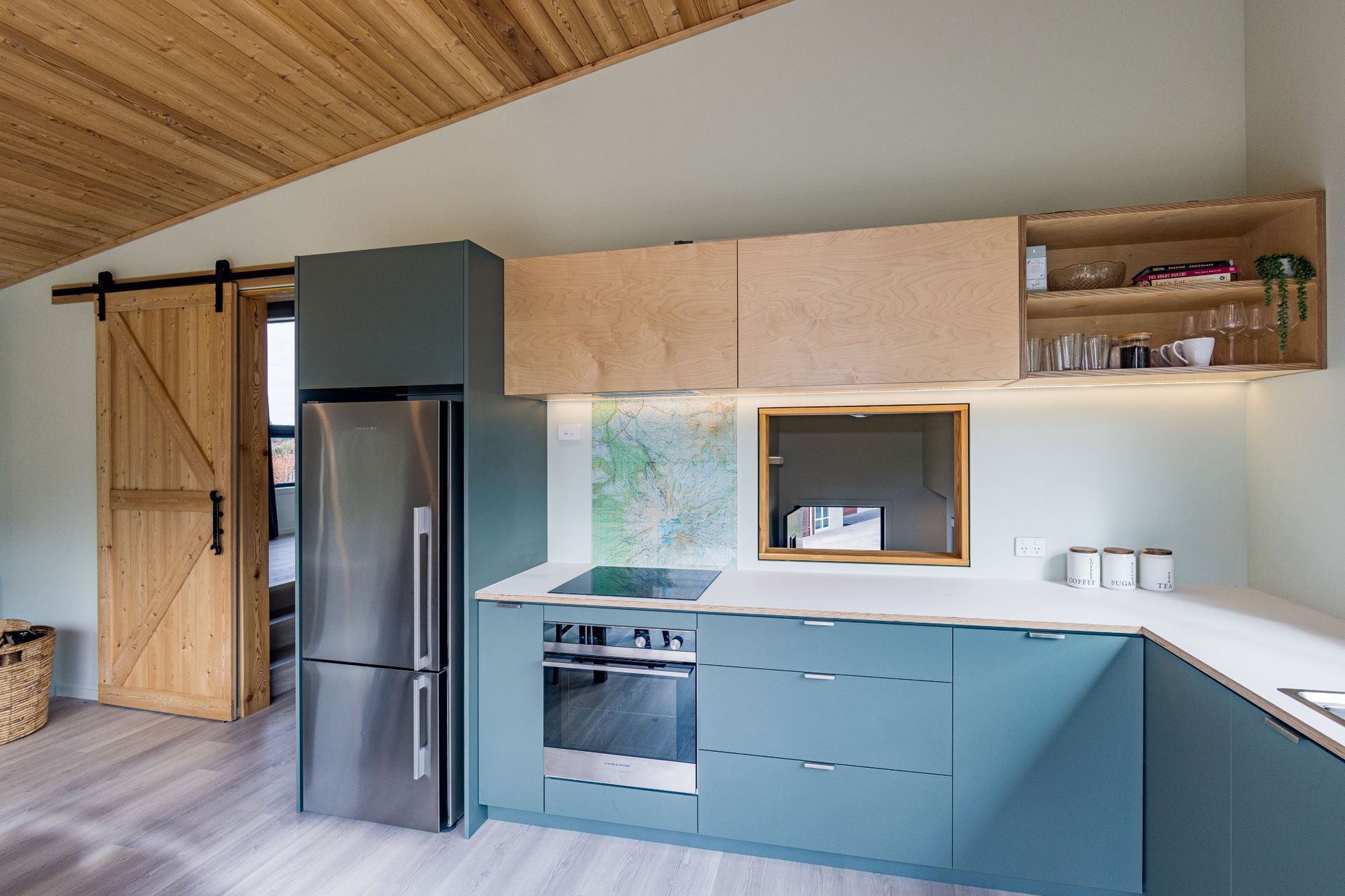 A splashback that features a map as a tribute to the region in this cosy home in Ohakune —Photography: Glyn Hubbard Photography
