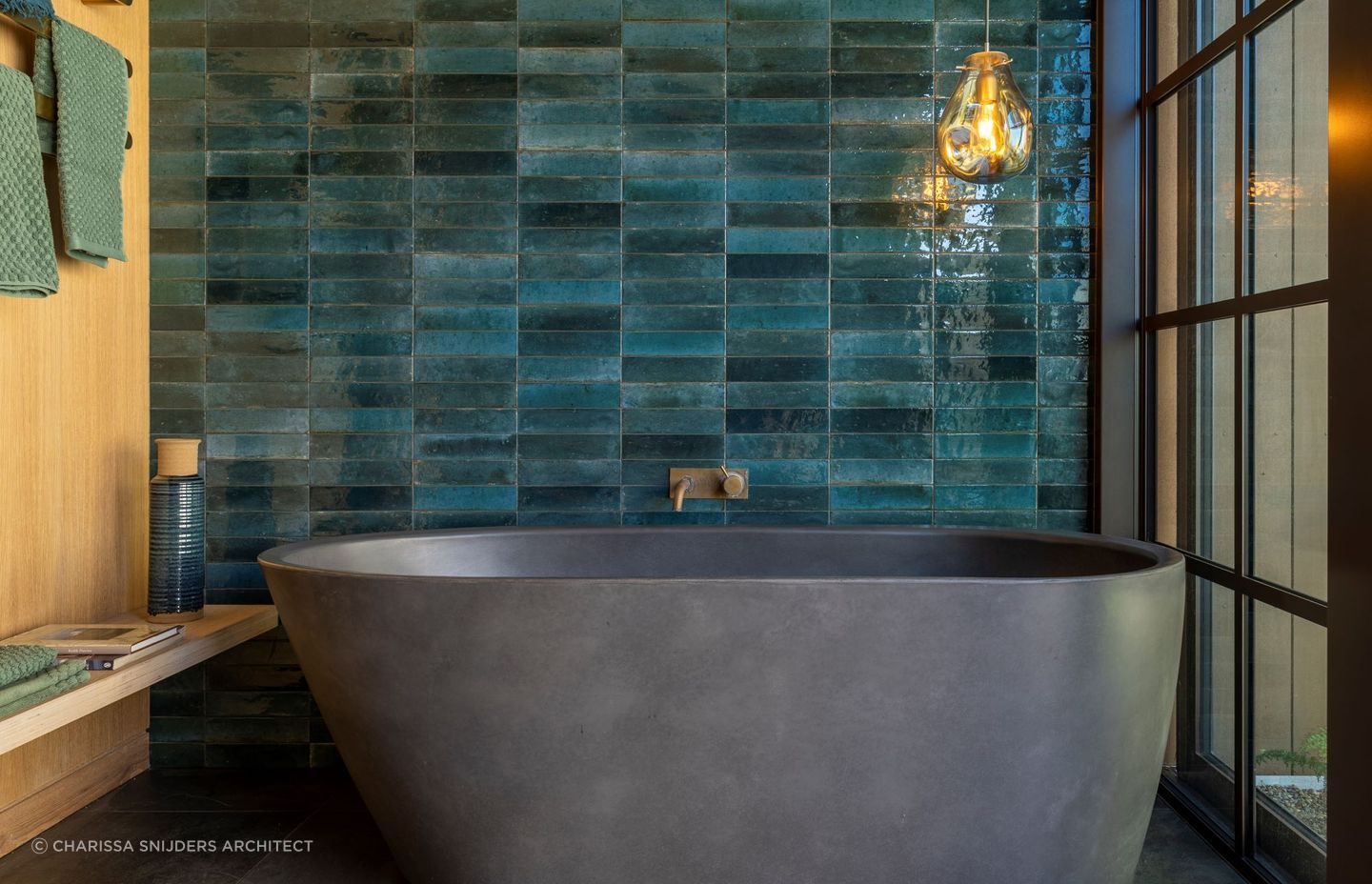This beautiful bathroom in a Waiheke Island home has a colour schemed inspired by the local kingfishers — Photography: Bridget Hackshaw