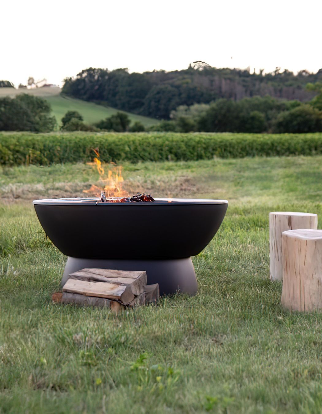 Outdoor fire pits add a rugged, rustic appeal to an outdoor area. Featured product: Hergom Meteor Cast Iron Fire Pit.