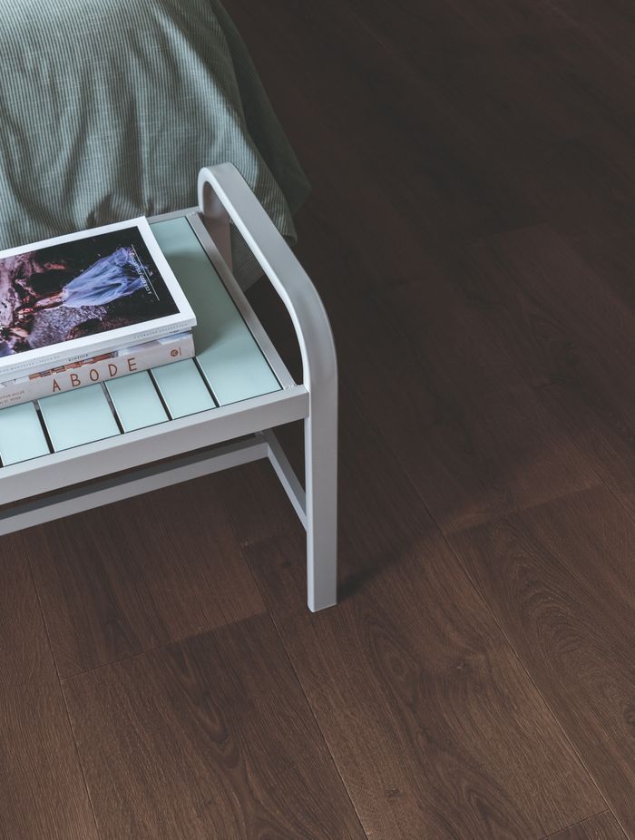 Dark timber tones create a sense of warmth and quiet luxury.