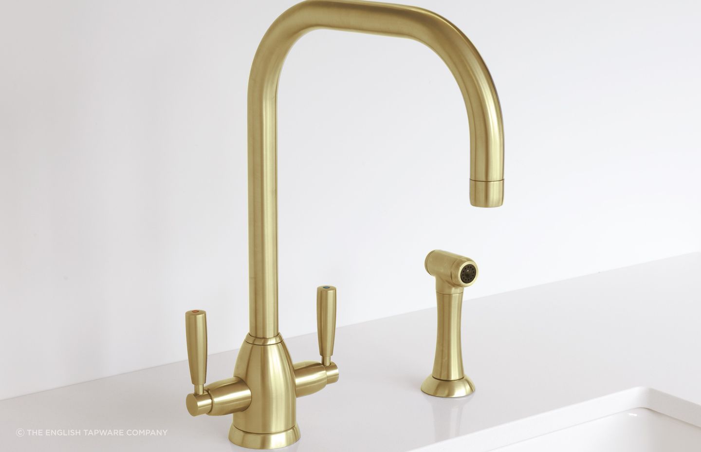 The Perrin &amp; Rowe Oberon Sink Mixer has a contemporary design with ergonomic with twin levers, seen here in a beautiful satin brass finish.