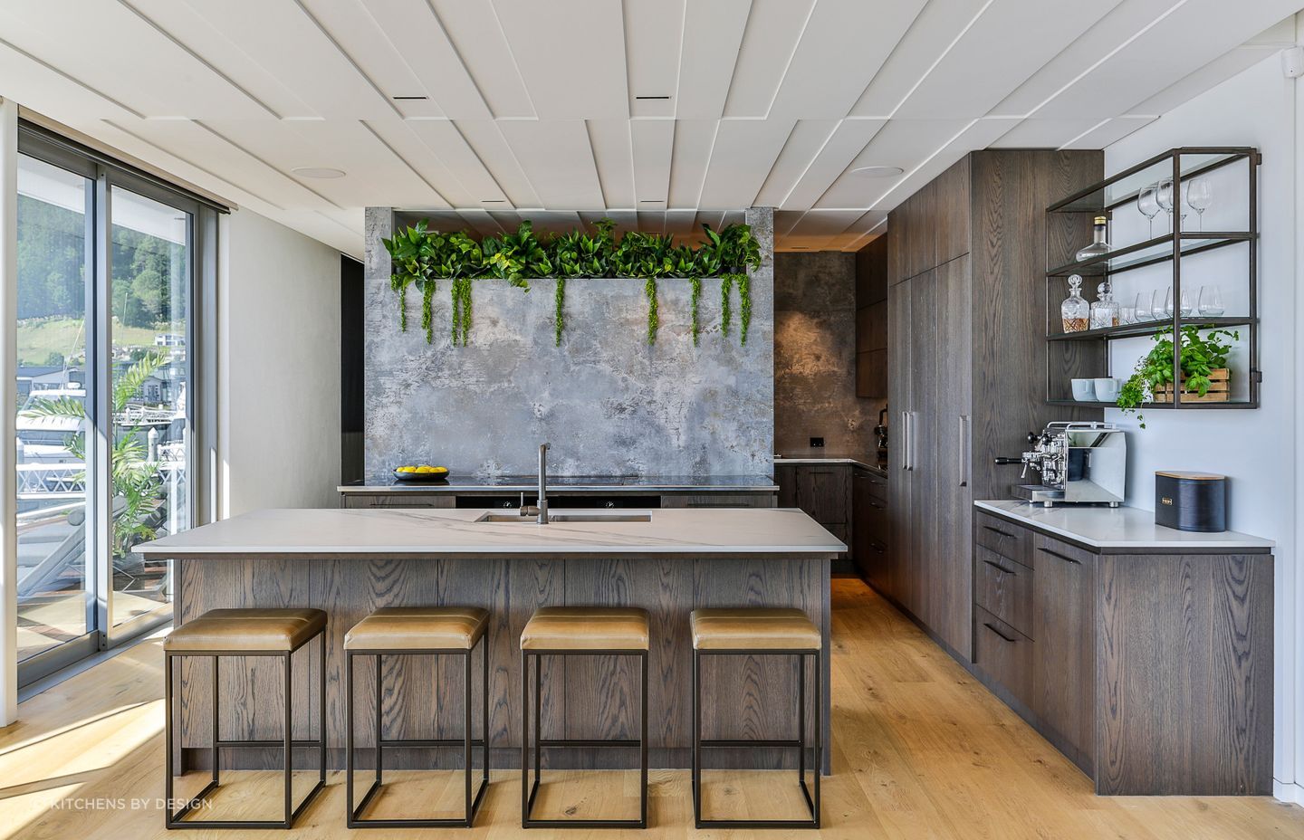 A stunning use of a splashback niche using hanging plants in this kitchen in Pauanui.