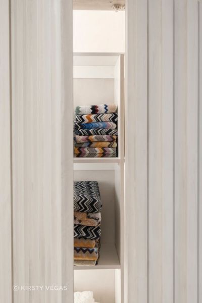 This clever use of space helped to create a hidden linen cupboard.