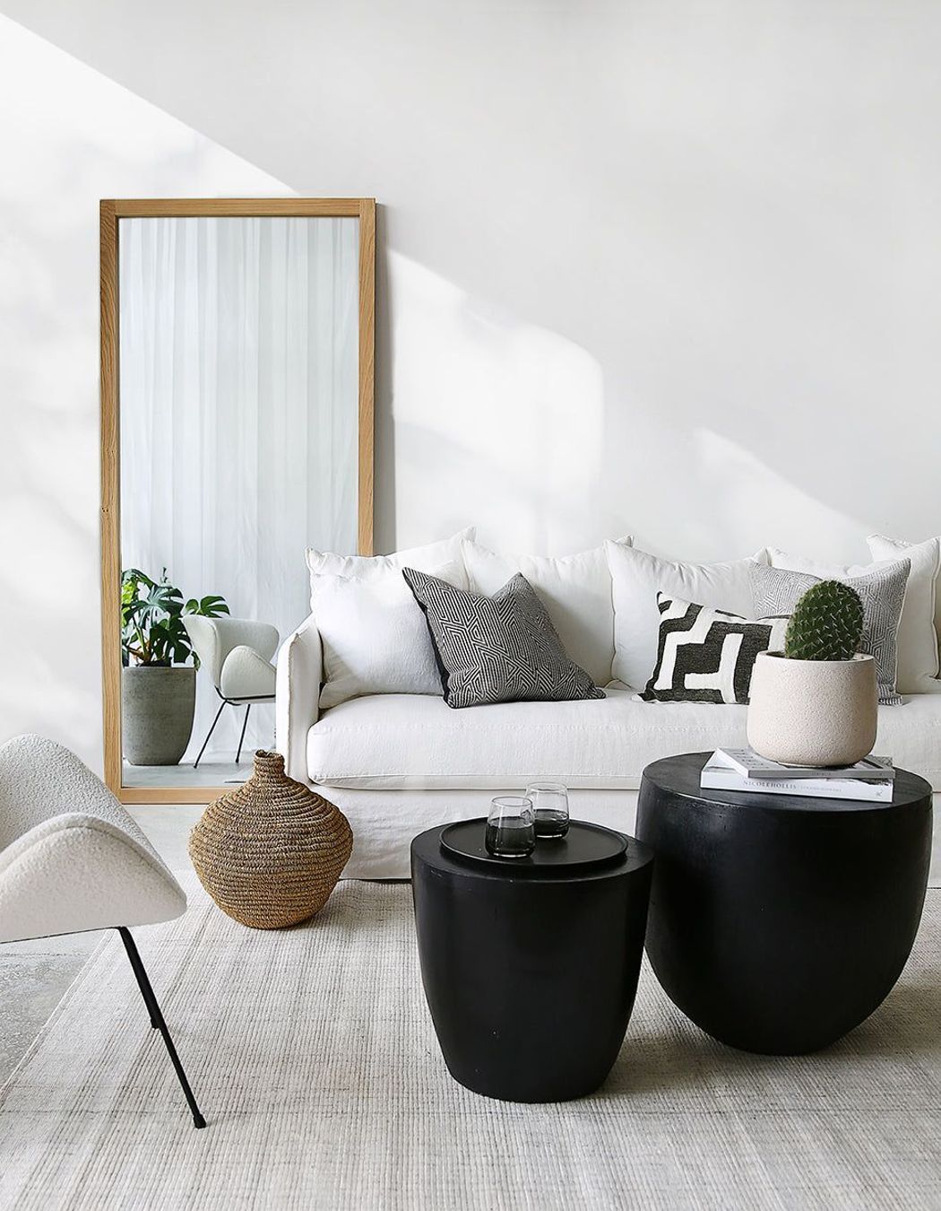 The Oak Mirror stylishly adds depth to this space.