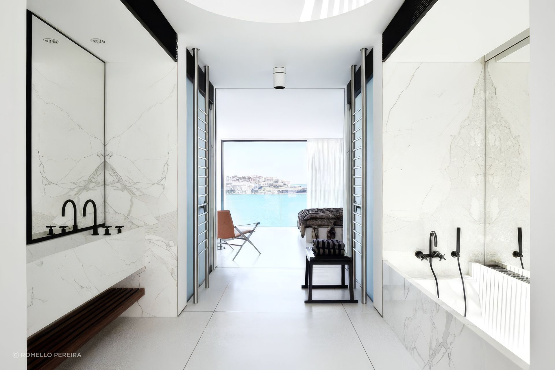 A stunning four-level residence in Bondi, was designed by Mathieson Architects to maximize a compact 120m2 site, featuring breathtaking views, high-quality finishes, and a seamless blend of indoor and outdoor living.