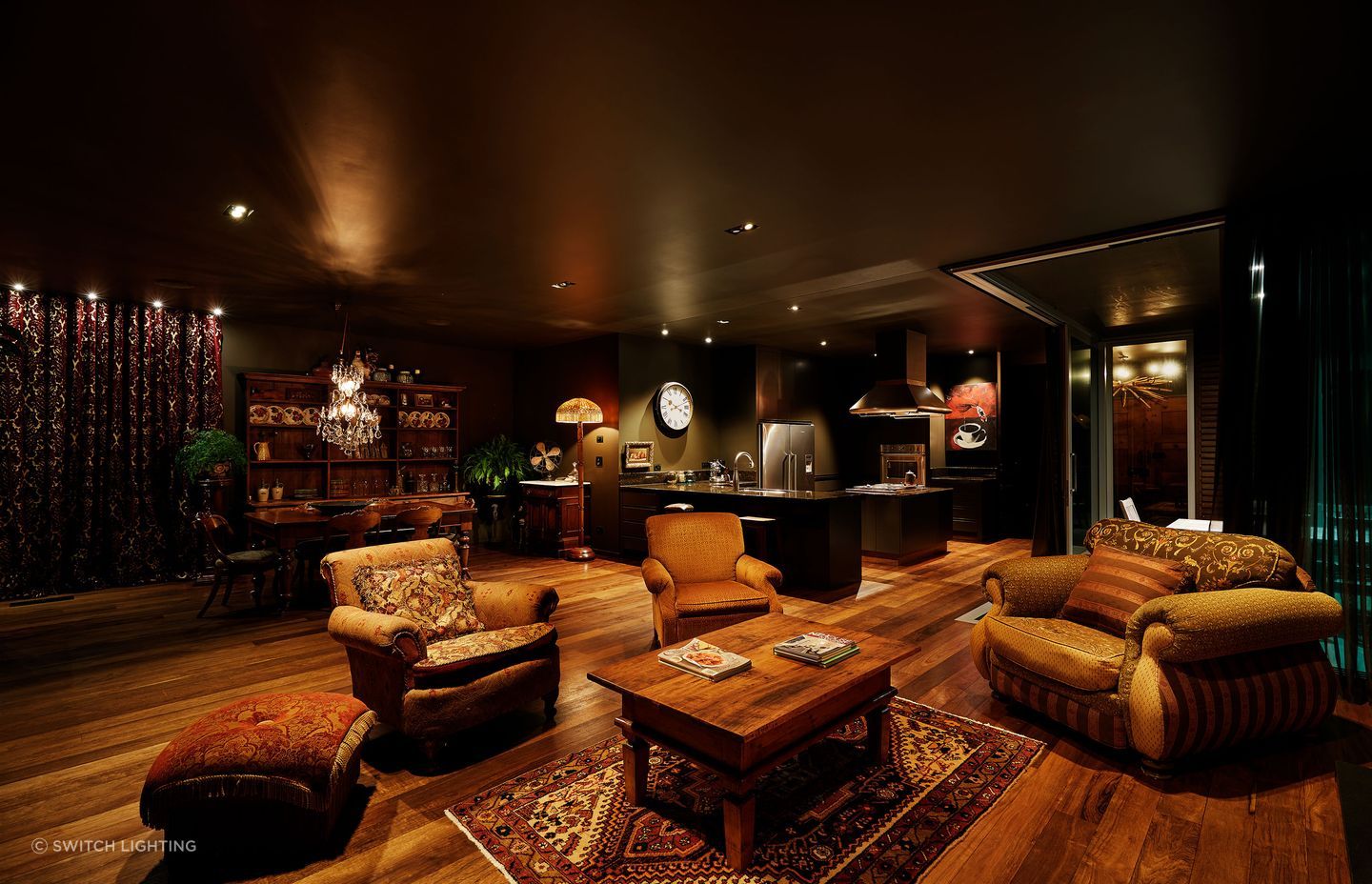 Layered lighting creates a cosy, soft ambience in this living room.