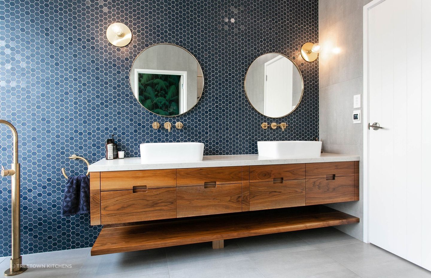 A feature wall of fine hexagon tiles in this Tamahere bathroom renovation.